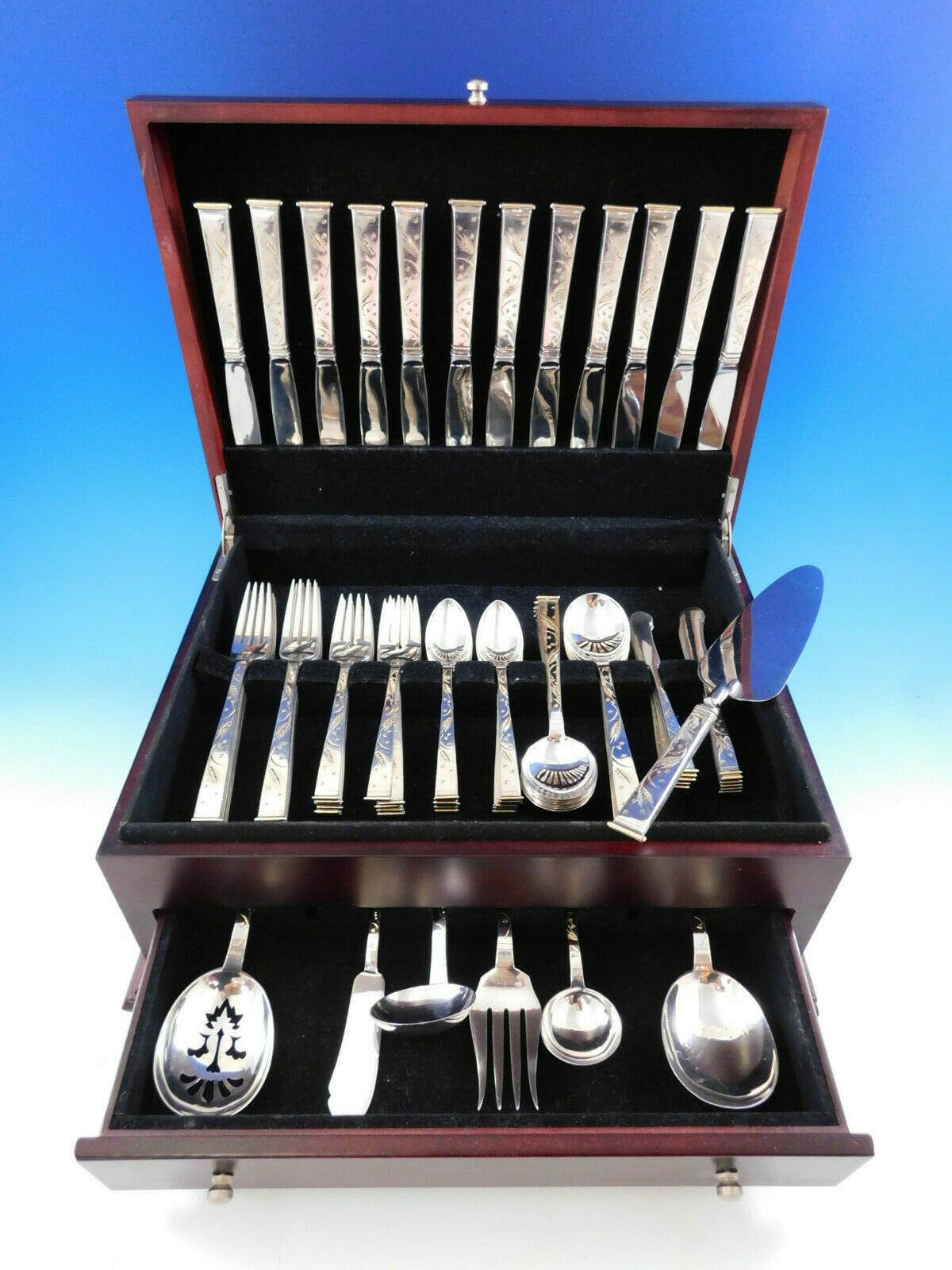 Golden wheat by Miyata Japanese 950 silver flatware set - 79 pieces. This set is 950 silver with 18-karat gold highlights on the wheat and the end of the handle. This set includes:

12 knives, 8 3/4