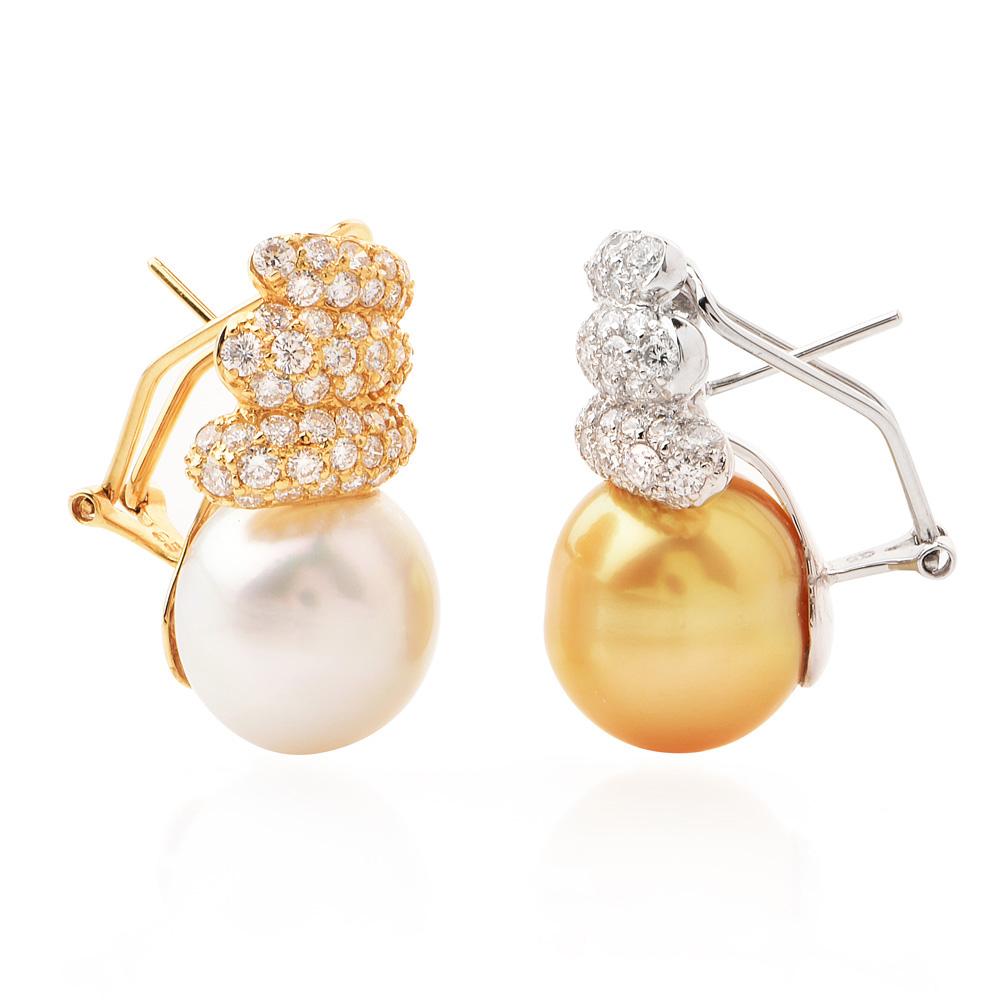 These glamorous Southsea earrings are created to in 18k yellow and white gold. 

Encompass these Golden and white color beautiful South Sea Pearls High Luosters, very smoth, hardly any belimishes,

measuring each  approx. 14mm in diameter ,

each