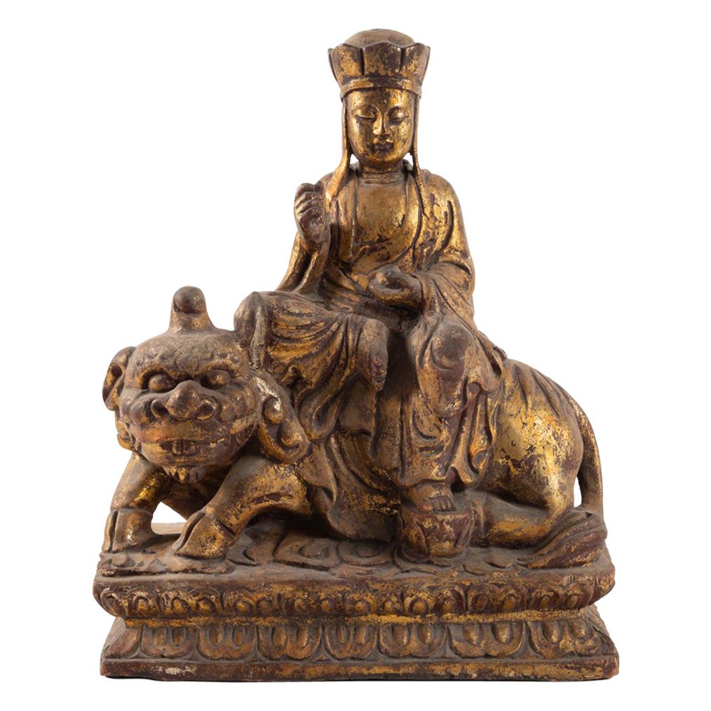 Golden Wooden Buddhist Deity, Seated on a Lion, China, Late 19th Century