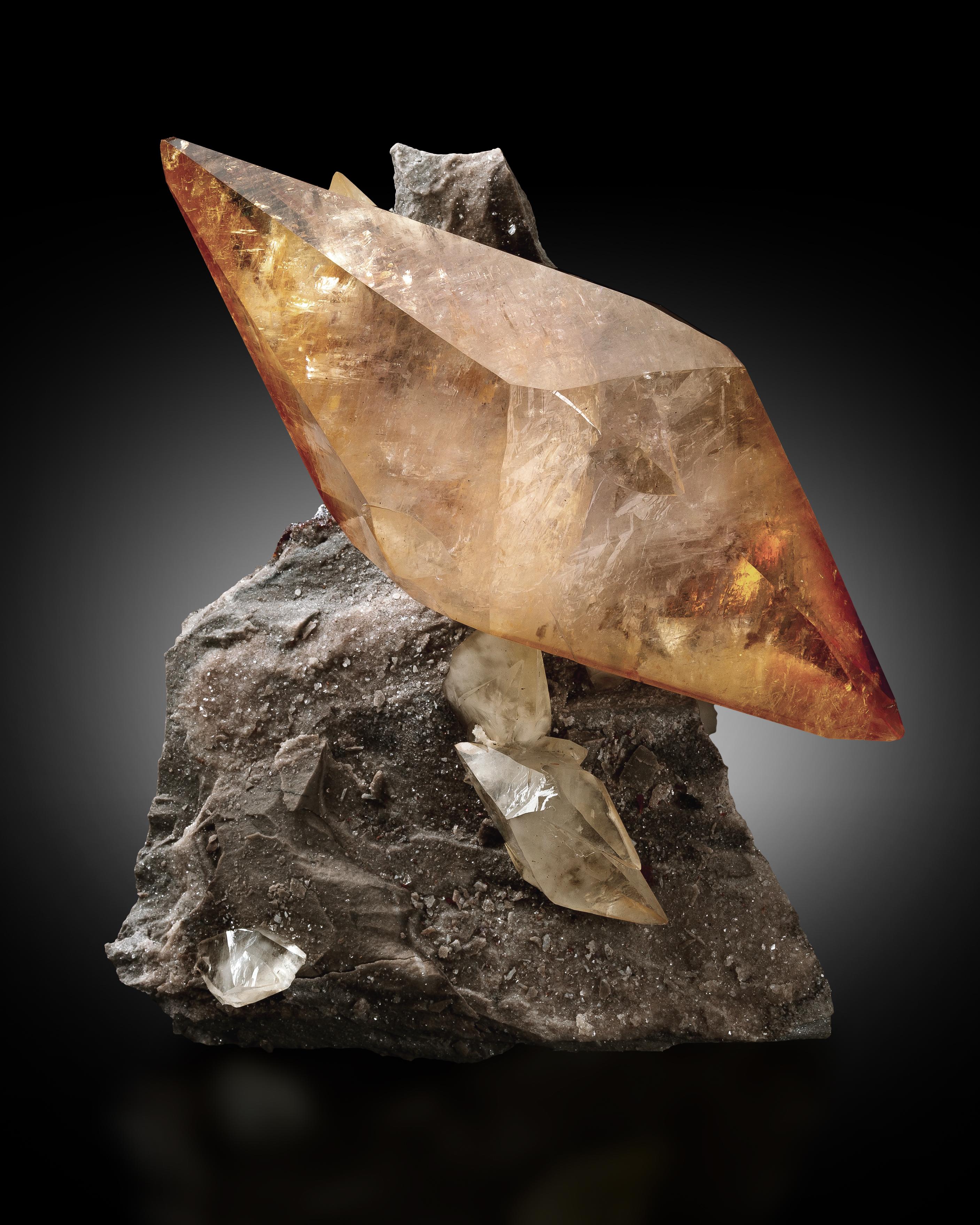 Although calcite is plentiful and diverse, calcite from Tennessee is instantly recognizable and highly sought-after for its twinned, scalenohedral crystal habit. Often, the scalenohedrons are twinned at their base, creating sculptural, doubly