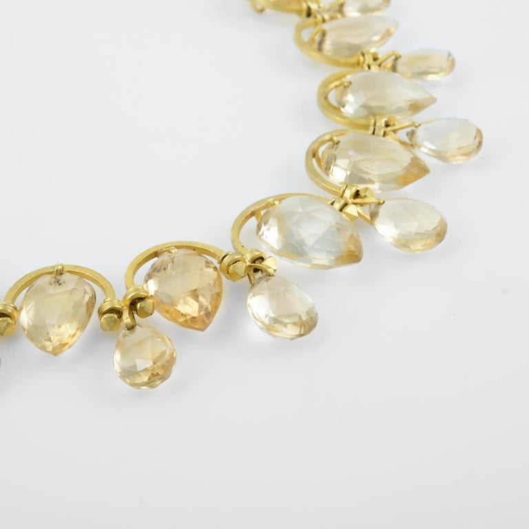 Finely detail statement necklace, crafted in 18 karat yellow gold. 

Faceted pear cut golden topaz ranges in size from 12.75mm x 10mm to 17.8mm x 12mm. The total approximate topaz weight is 160 carats. The lower topaz drops graduate in size.  

The