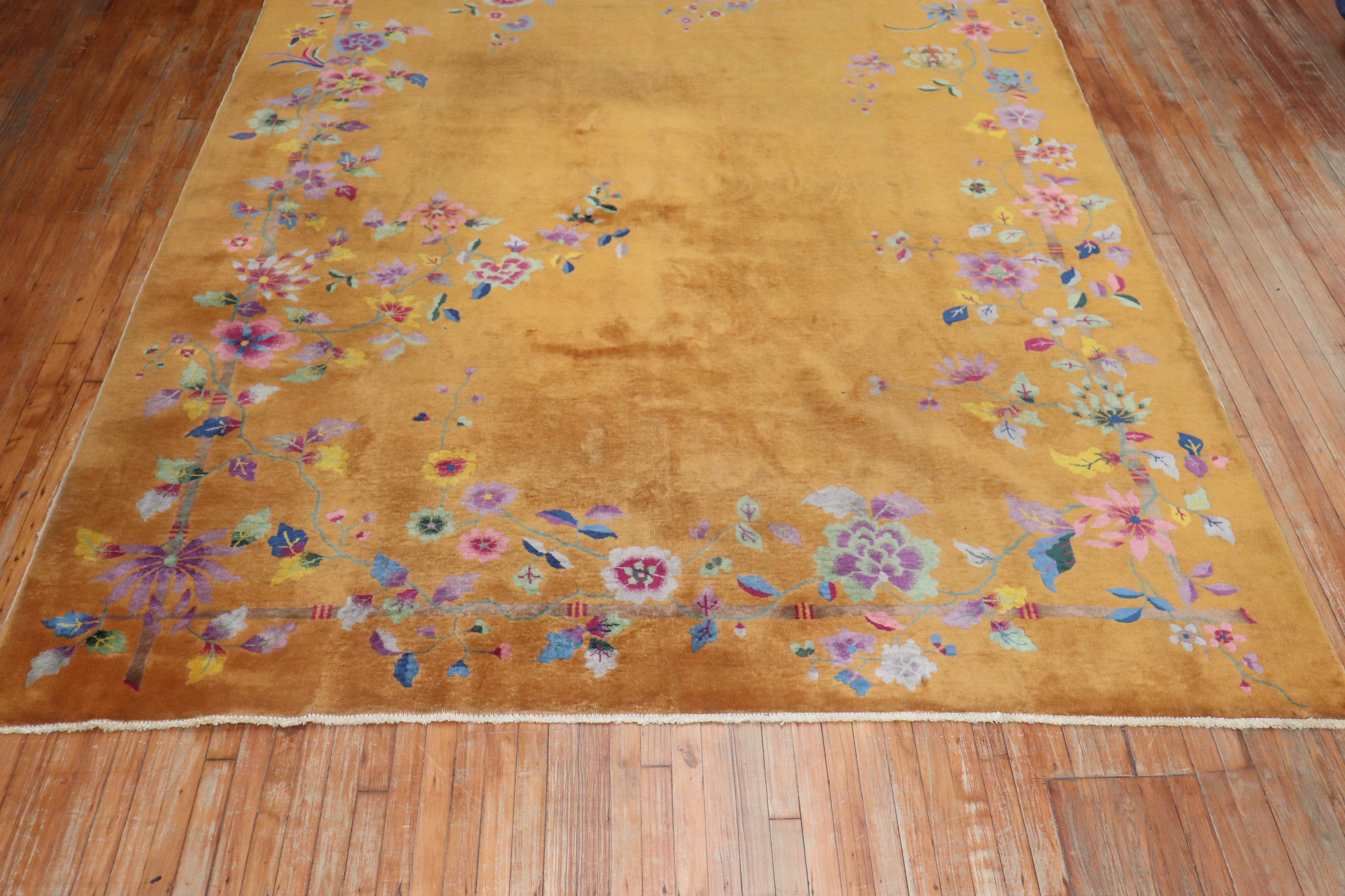 An authentic mid-20th century Chinese Art Deco with an spacious open field floral design in goldenrod


Measures: 8'10'' x 11'3''.