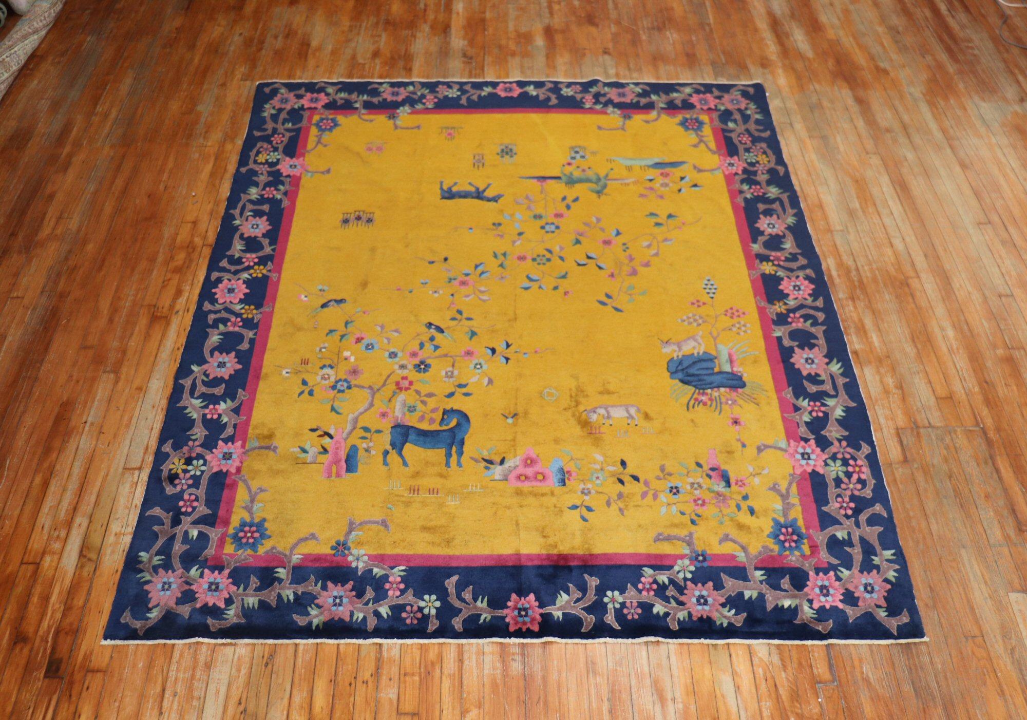 A Chinese Art Deco Nichols rug with a pictorial animal design on a goldenrod field surrounded by a pink and plum floral motif navy border

Measures: 7’10” x 9' 8