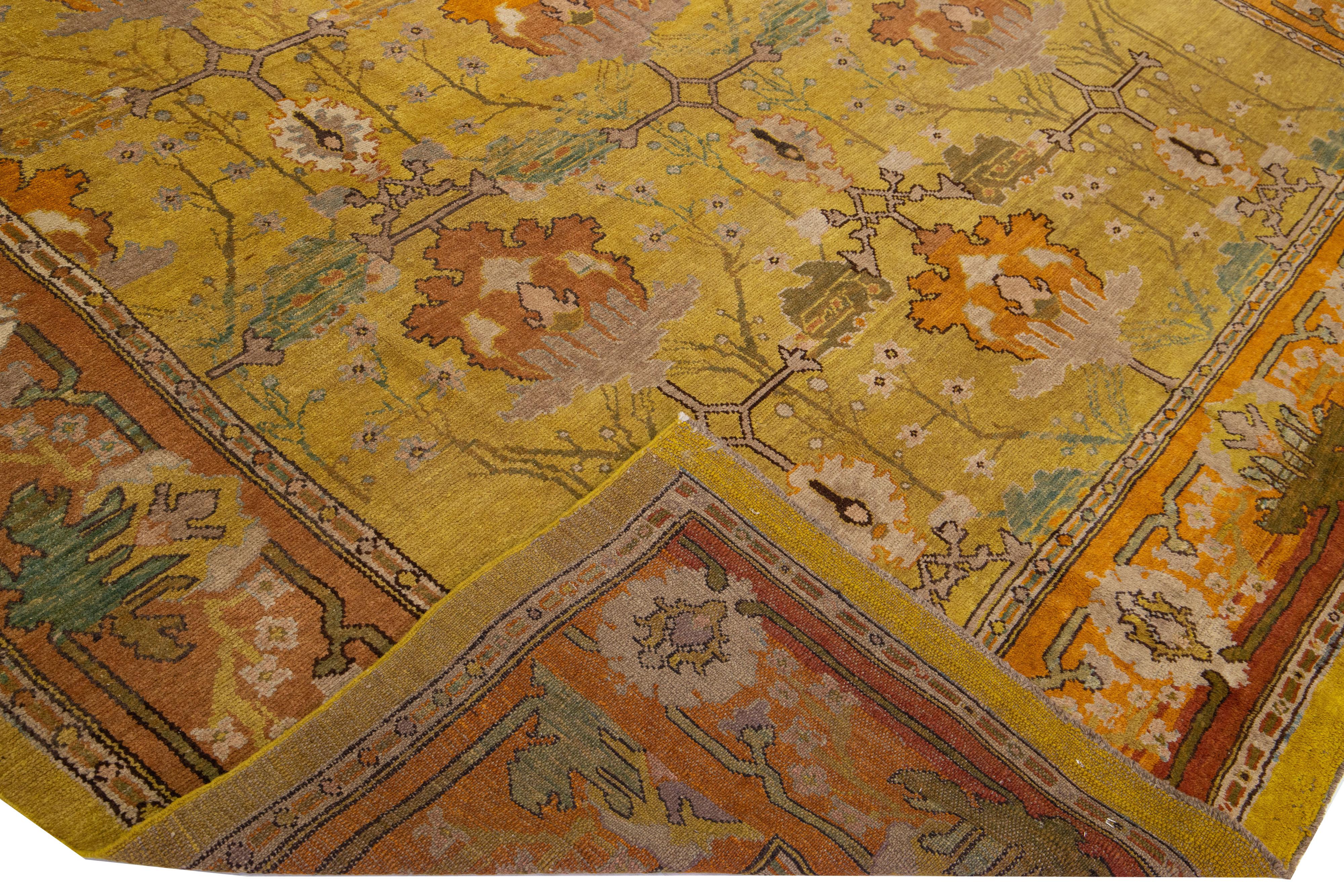 Beautiful vintage beautiful Art & Crafts style hand-knotted wool rug with the goldenrod color field. This Persian rug has an orange frame with multi-color accents in an all-over floral design.


This rug measures: 9'8