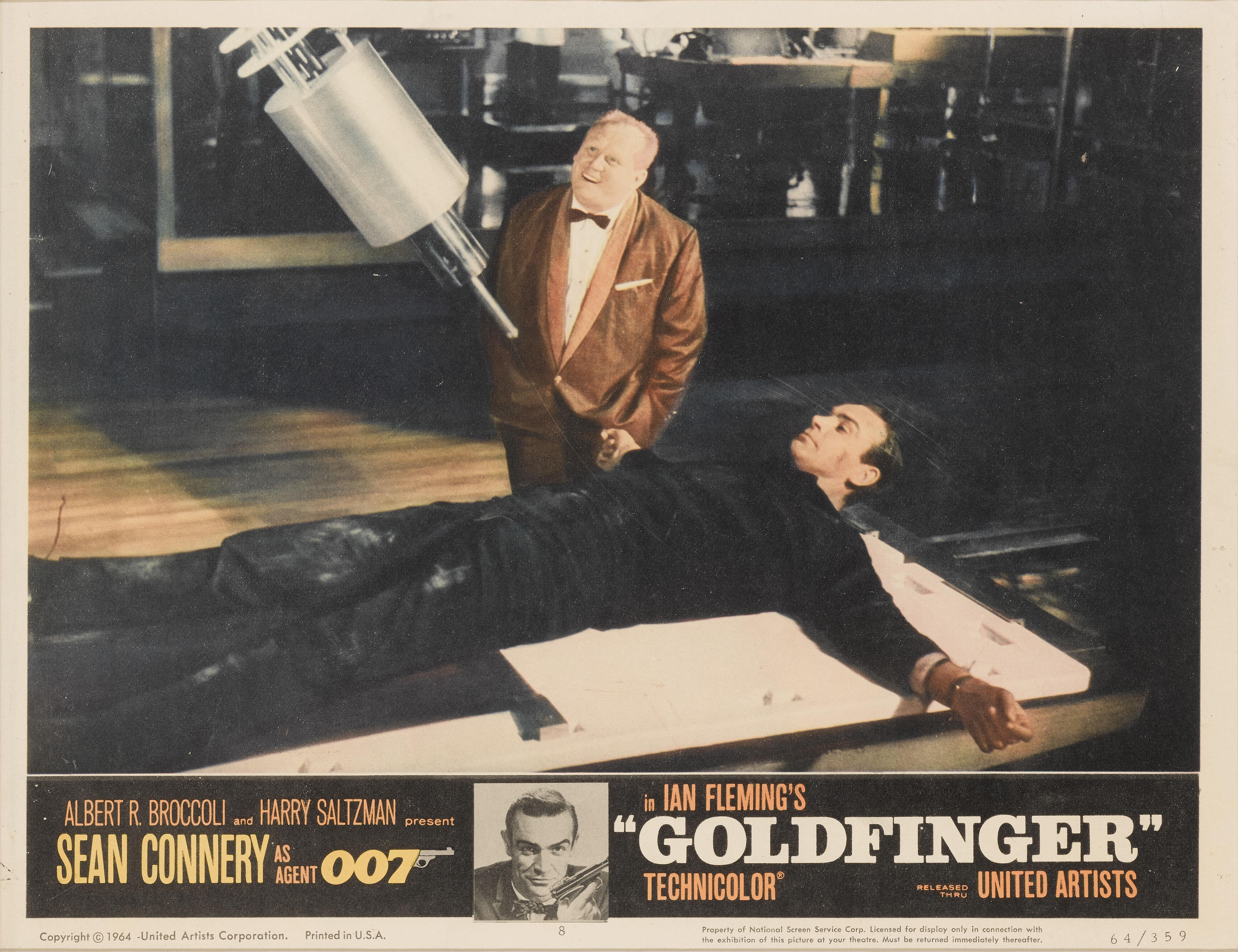 Original US lobby card number 8 used for Goldfinger 1964. This was the third time that Sean Connery would play James Bond 007, and the first of four Bond films that Guy Hamilton would direct. It is a hugely popular film in the Bond series, with the