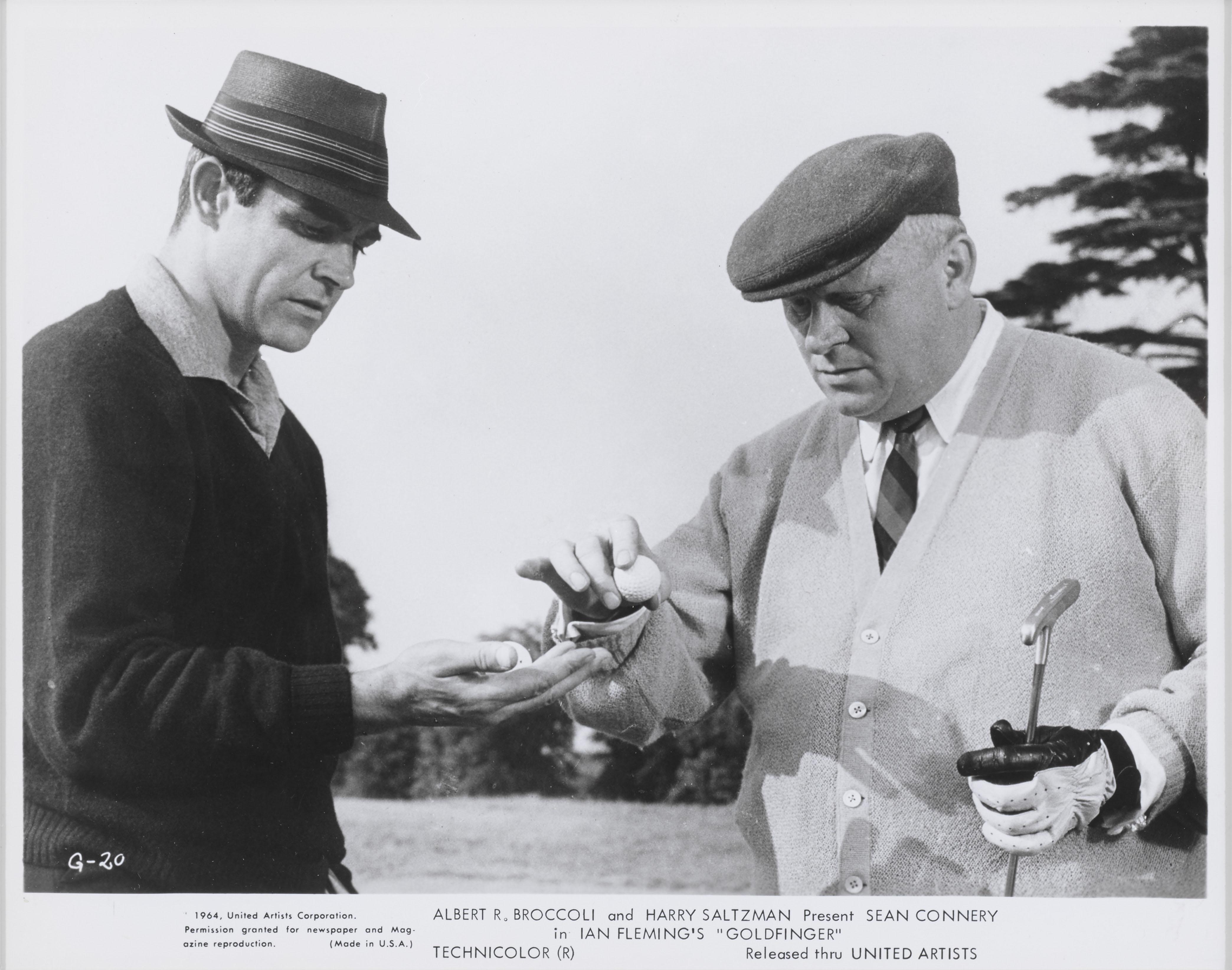 Original photographic production still from James Bond's Goldfinger 1964. 
This  was the 3rd James Bond film and the 3rd time Sean Connery played 007. This piece is conservation framed in a Sapele wood frame with acid free card mounts and UV