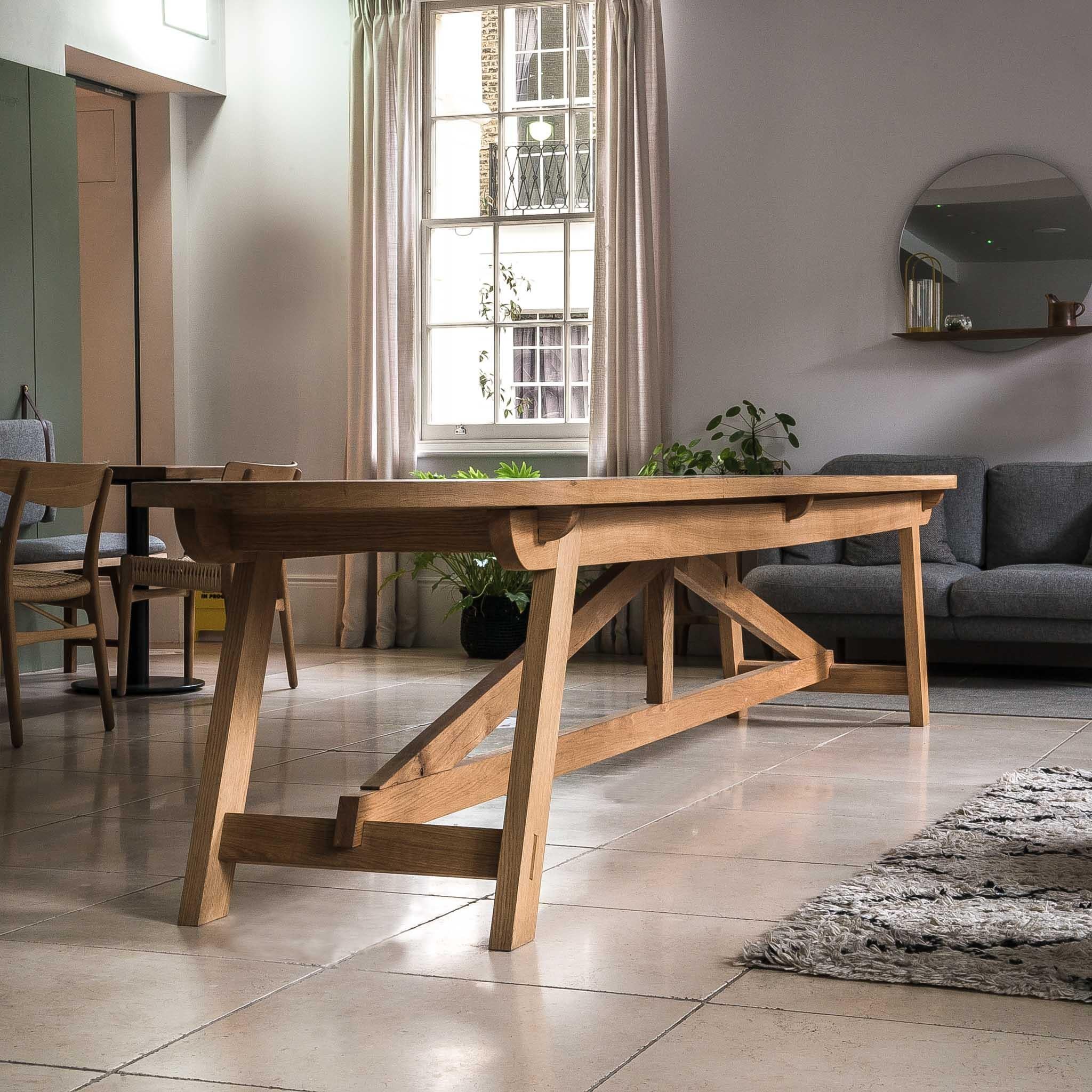 This elegant and classic dining table focuses on purity of form, and is the perfect meeting place for sharing delicious food and wine with family and friends. The table is crafted using timber-frame joinery and British hardwood of the finest