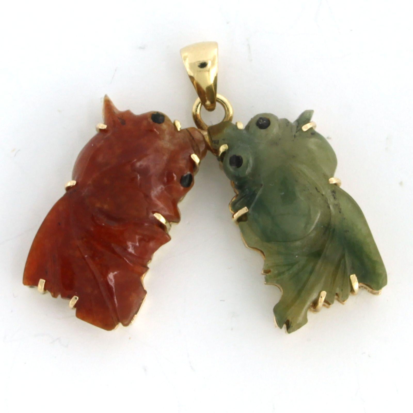 14k yellow gold pendant with two jadeite goldfish

Detailed description

The pendant is 3.1 cm high and 3.9 cm wide

Total weight 9.7 grams

Set with

- 2 x 2.4 cm x 1.4 cm goldfish shape cut jadeite

color: red and green
clarity: n/a

The pendant