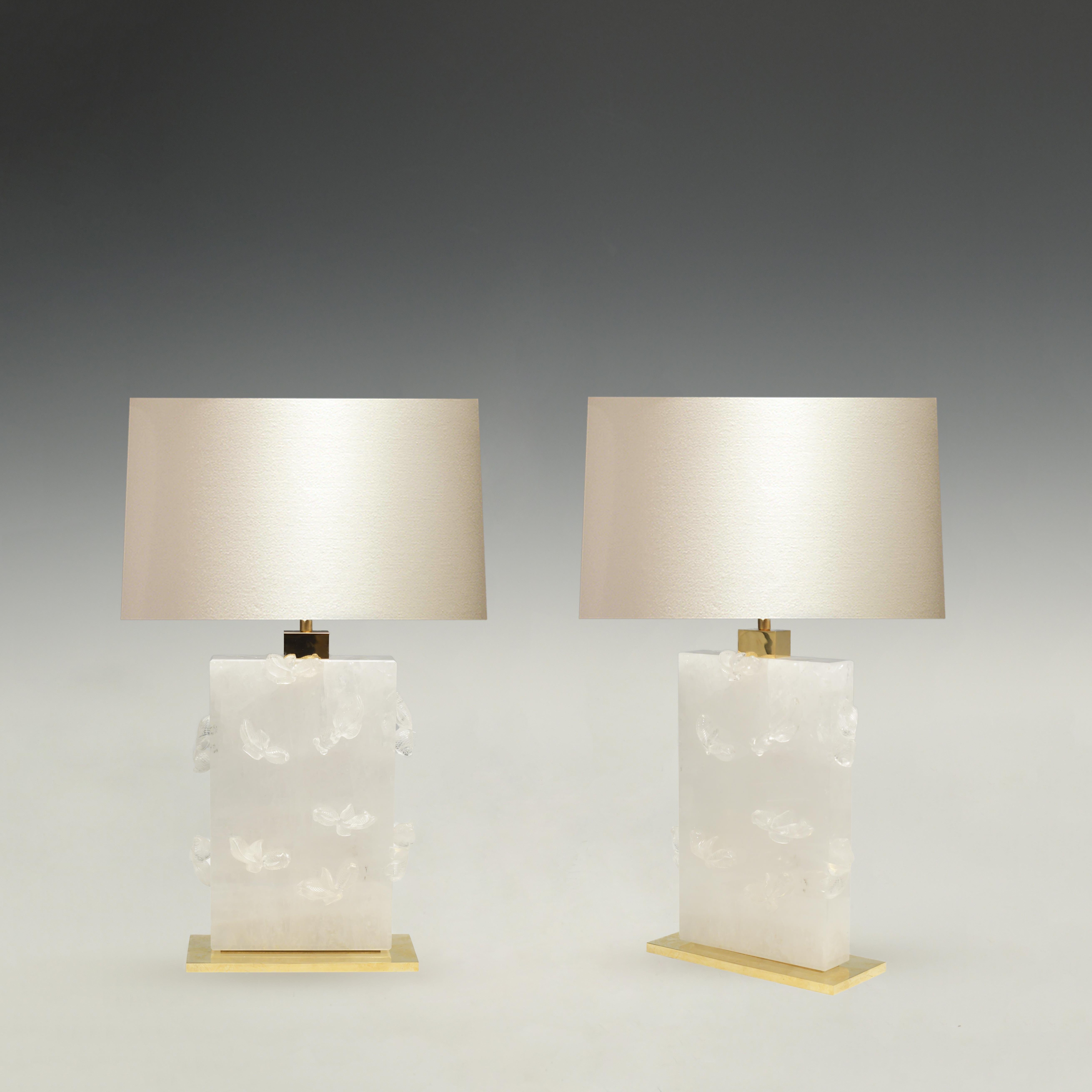 Pair of fine carved swimming goldfish rock crystal lamps with polish brass decoration. Created by Phoenix. To the top of rock crystal is 13.5 in. Each lamp installs two sockets. Lampshades do not include.