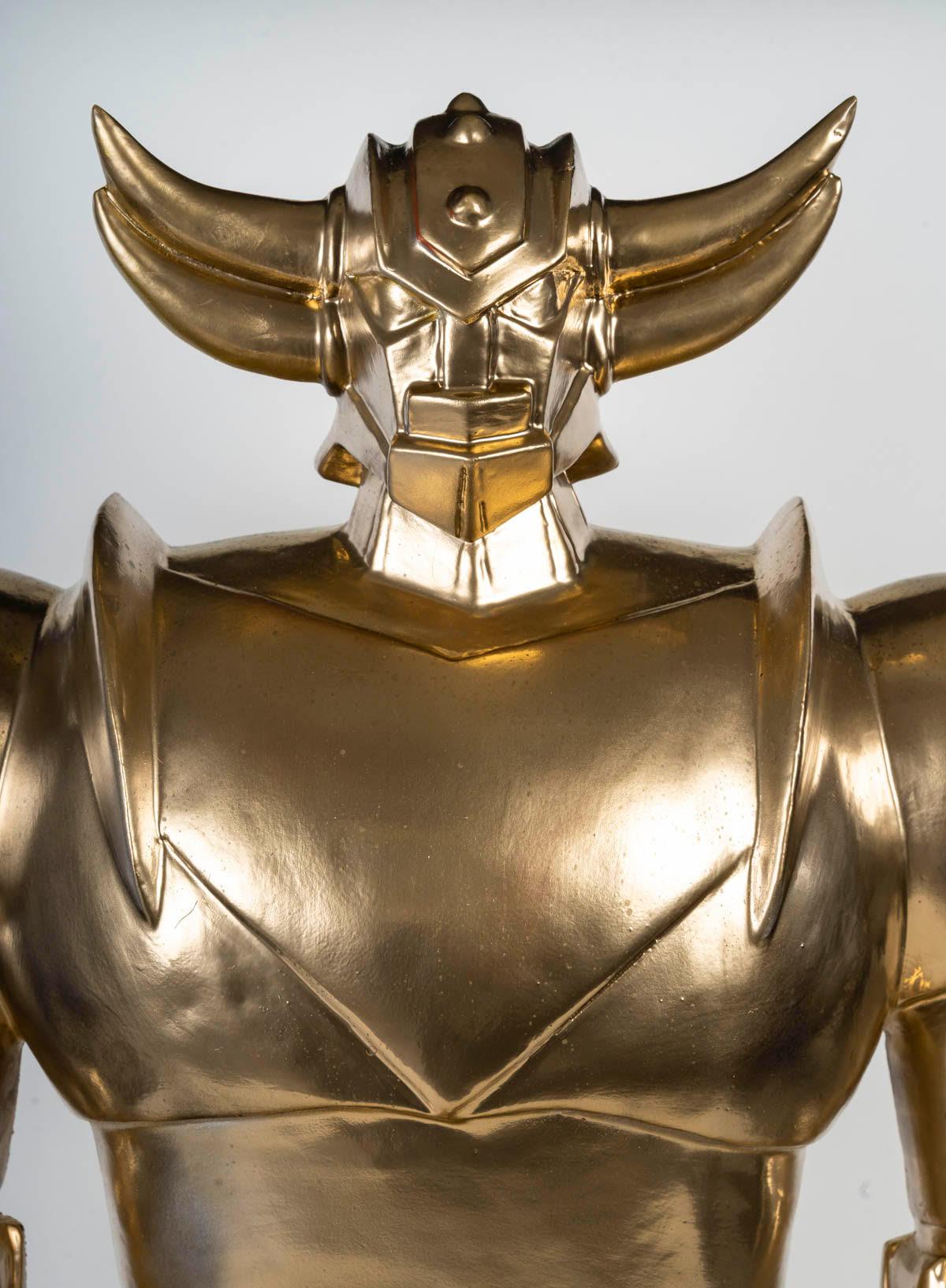 Goldorak sculpture in painted resin, gold colour, 20th century, modern art.

Goldorak sculpture in painted resin, gold colour, 20th century, modern art.
H: 95cm, W: 44cm, D: 20cm