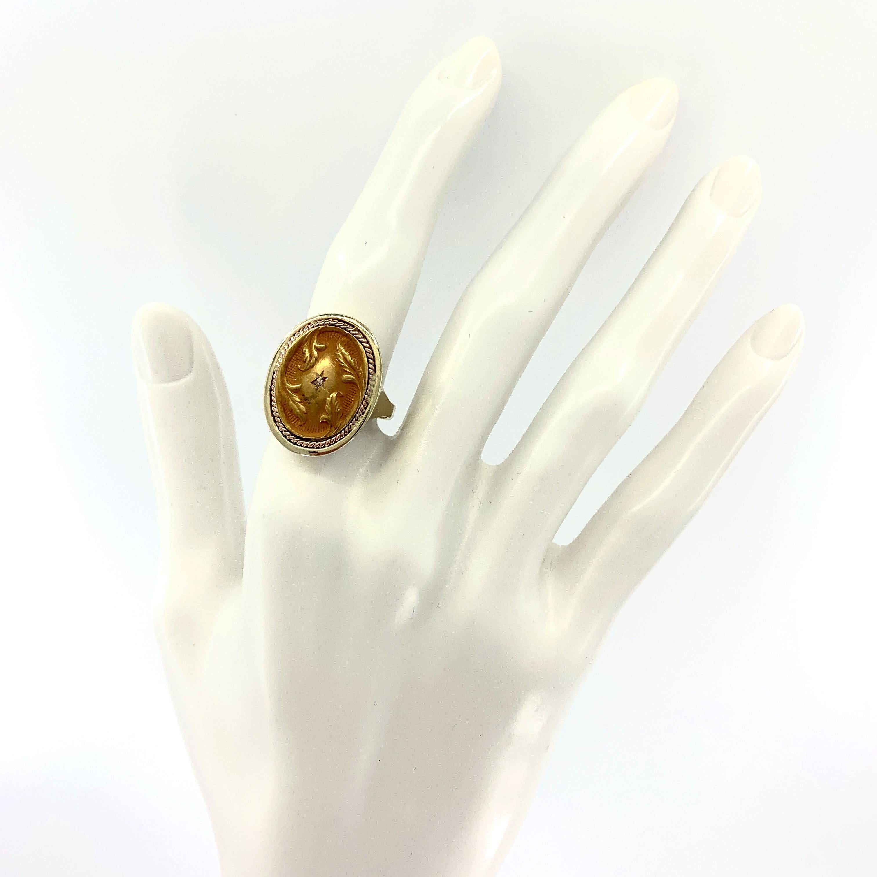 This was originally a blank signet ring set with a sad-looking onyx, but since we're always looking for a way to unburden the store of its cufflinks, we popped out the offending agate in favor of a very old 18 karat yellow gold cuff stud. 

The pale