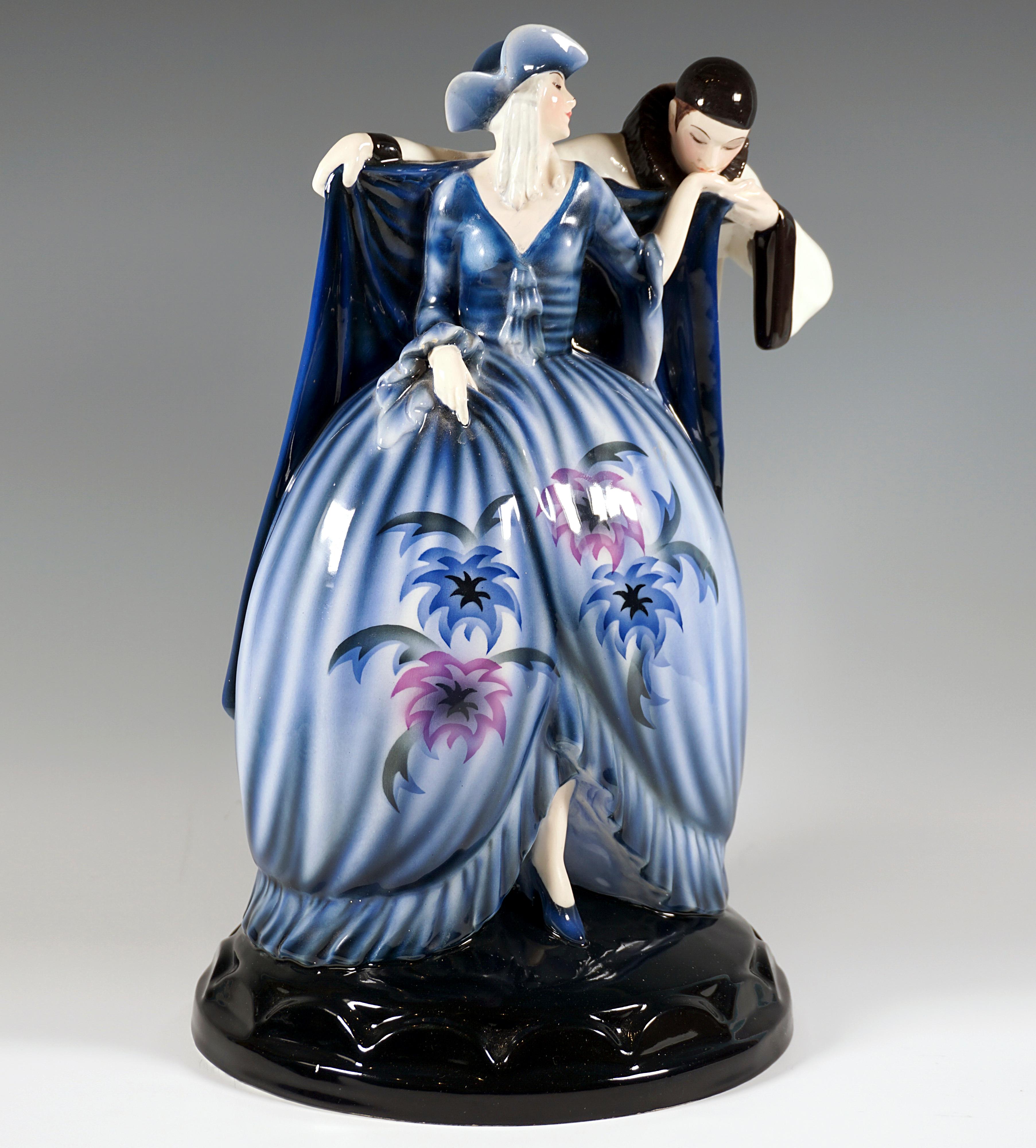 Depiction of a carnival dancing couple: Harlequin kissing the hand of his Columbine. The female figure in a close-fitting blue top with a low-cut front and long trumpet sleeves, a voluminous blue skirt with large floral decorations in blue, purple