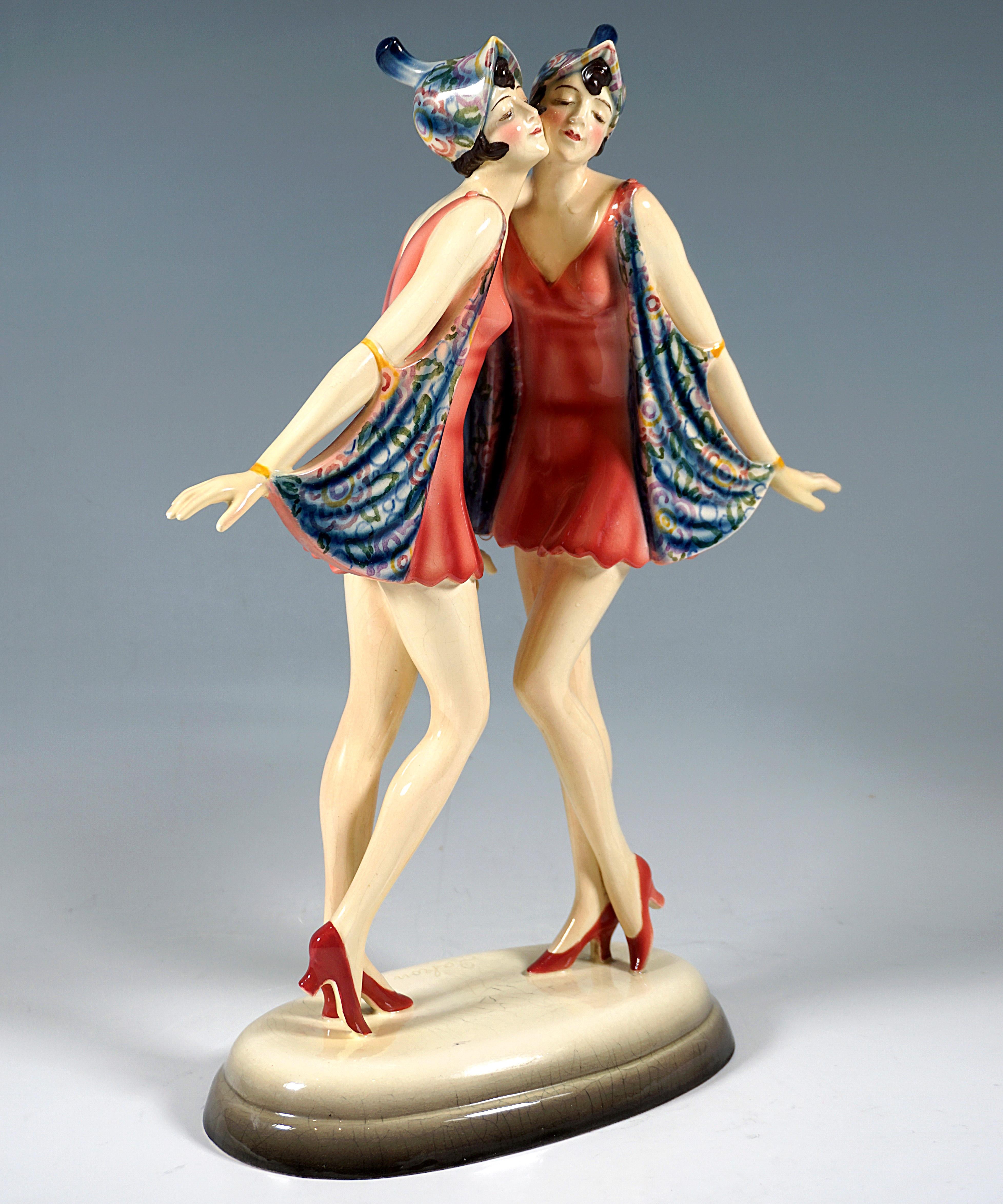 Very Rare Viennese Ceramic Group Of Figures from the 1920s:
The Dolly twins as graceful dancers, posing cheek to cheek with eyes closed, lifting the arms fastened wings of their short dresses, short dark hair covered by matching headdress.
On a