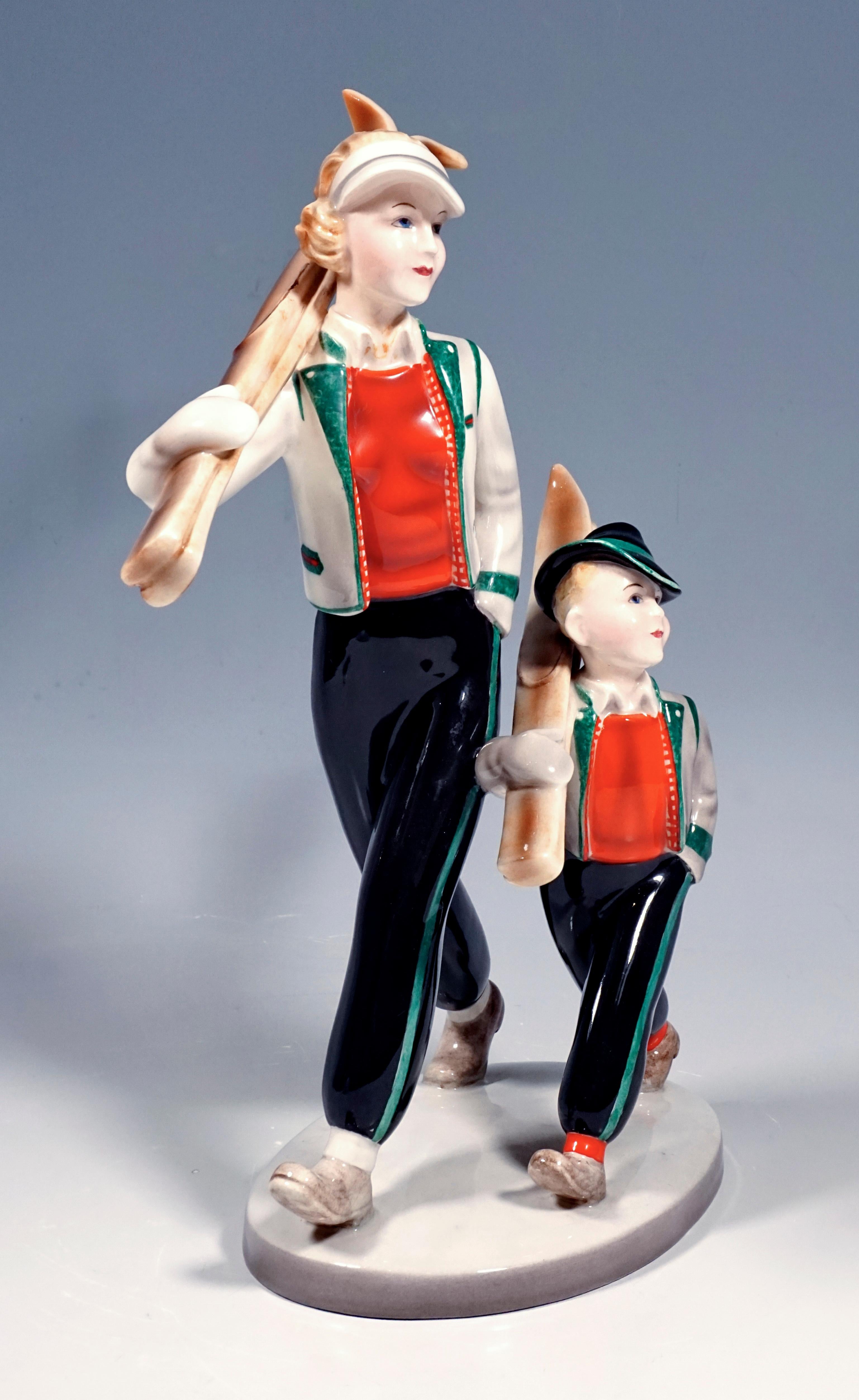 Rare Goldscheider Vienna Figurine Group of the 1930s.
Two figures walking side by side, mother and child with shouldered skis. Both ware winter clothing that was common in Tyrol in the 1930s: black trousers with cuffs and jackets in traditional