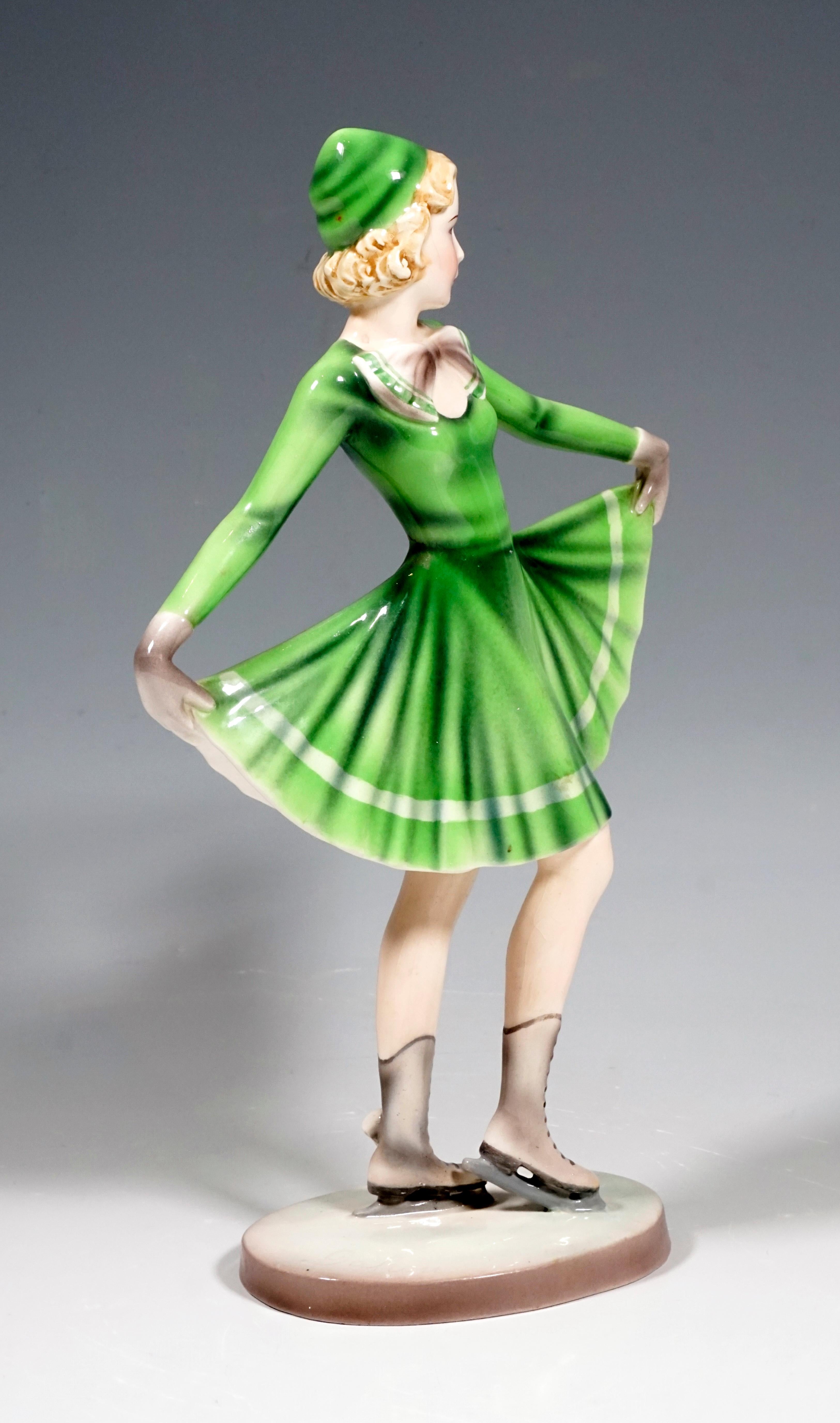 Very rare Goldscheider Vienna Art Deco Figurine of the 1930s.
Standing young ice skater, holding up the skirt of her green-colored skating costume like a fan.
On a cream-colored oval base. Artist's signature 'Dakon' on the top of the base at the