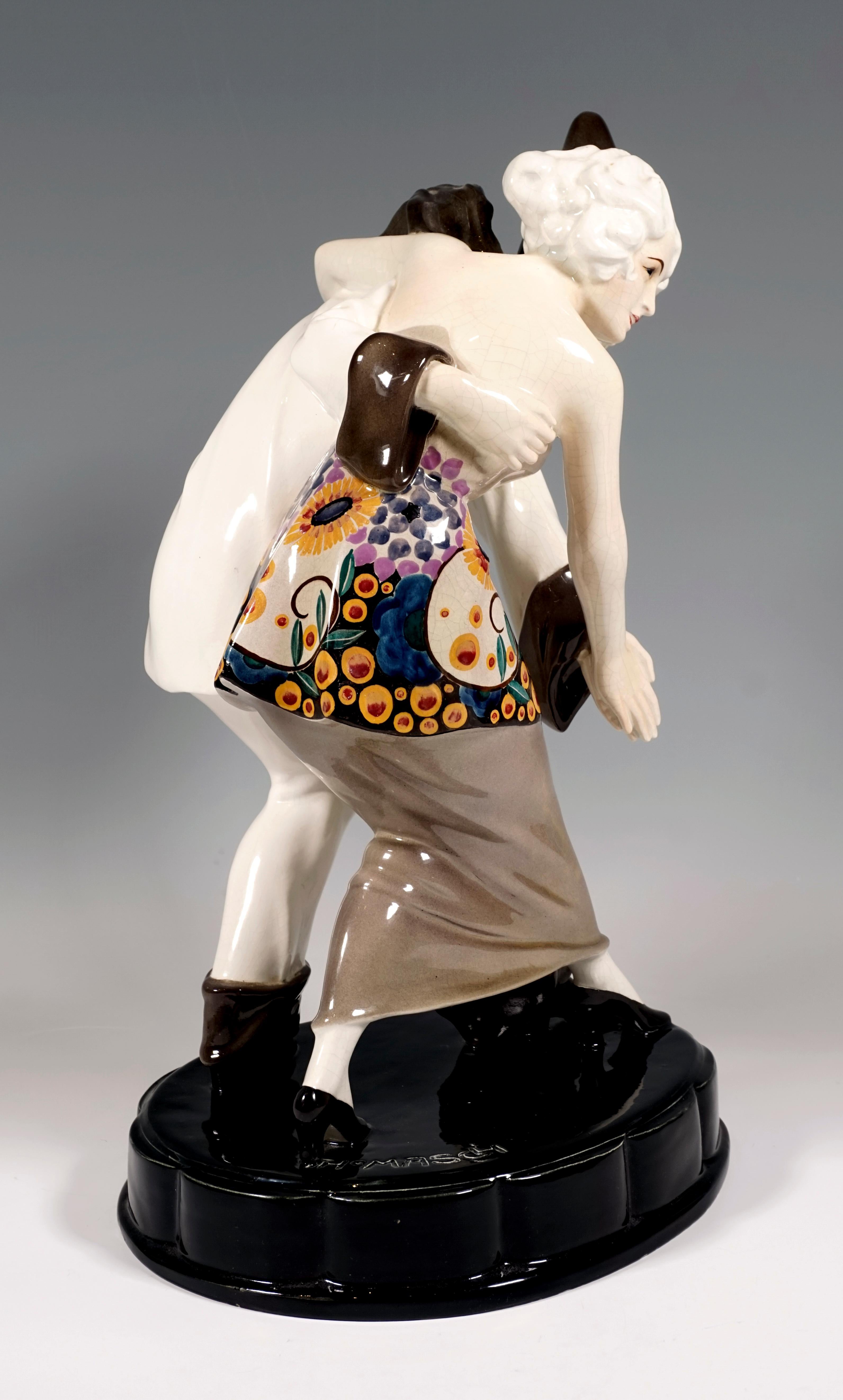 Very rare Art Déco Goldscheider ceramic figurine group:
The Pierrot in a white trouser suit with large gray-brown buttons, cuffs, ruff and pointed hat and the petite dancer with pinned up hair lead a dance step, each laying one arm around the other