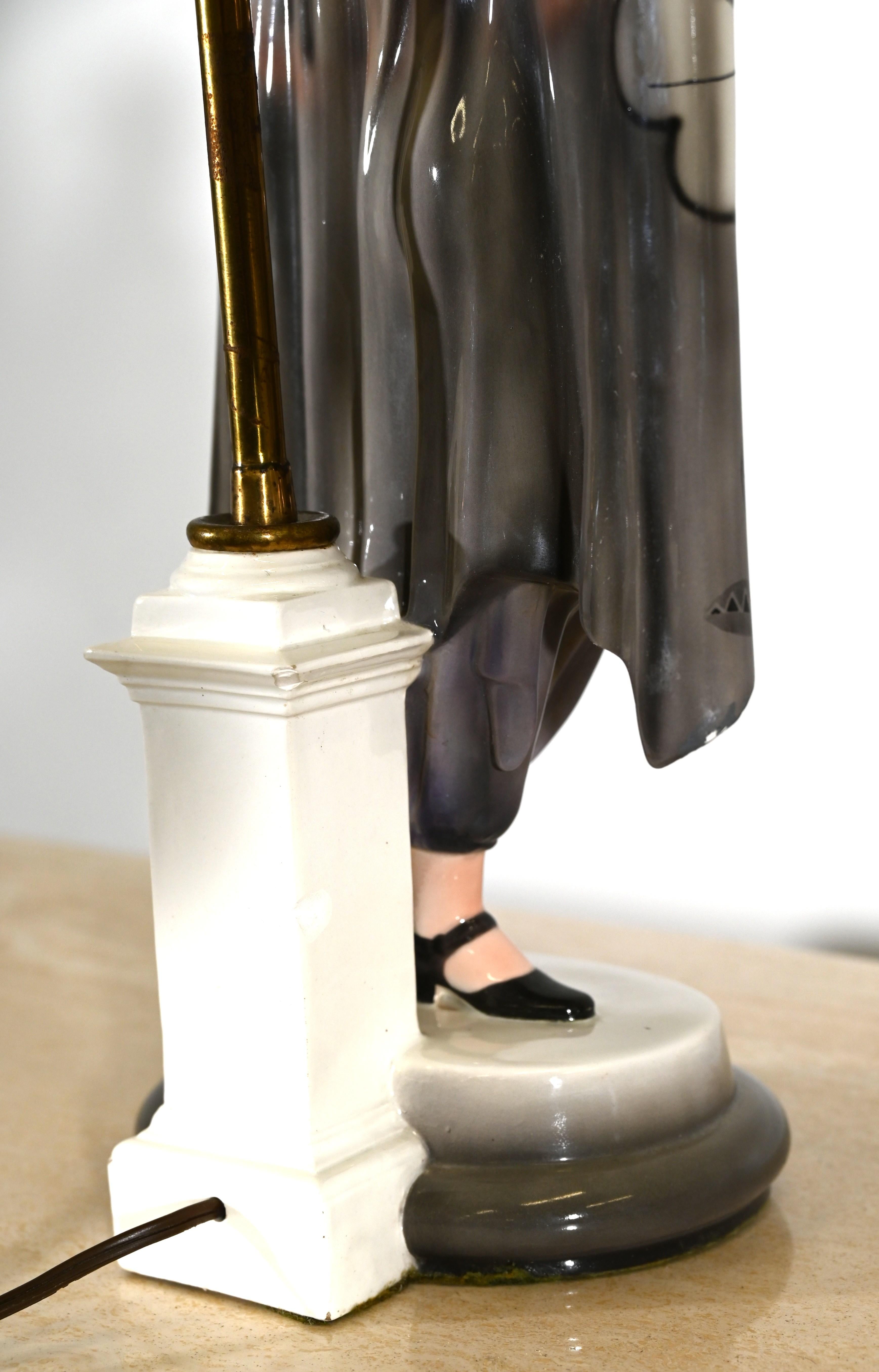 A beautiful Goldscheider Art Deco ceramic figure by Josef Lorenzl, 1920s.  This amazing figure of a standing lady is in period costume with hand-painted flowers and art deco motifs. The sculpture has some minor chips, as shown in the video and