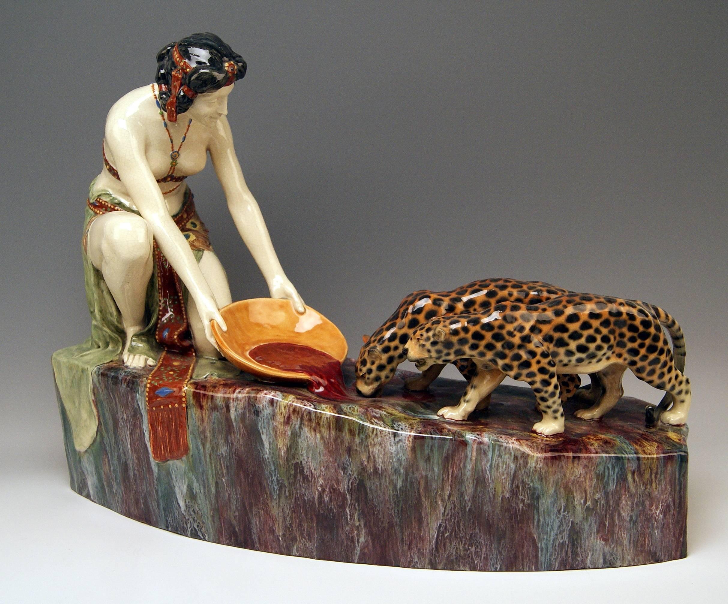 Goldscheider Vienna gorgeous huge figurine group, depicting following sculptured figurines:
Oriental lady with two leopards, feeding them with blood

Designed before year 1910-1914 / made circa 1925: There aren't any marks existing (= quite early