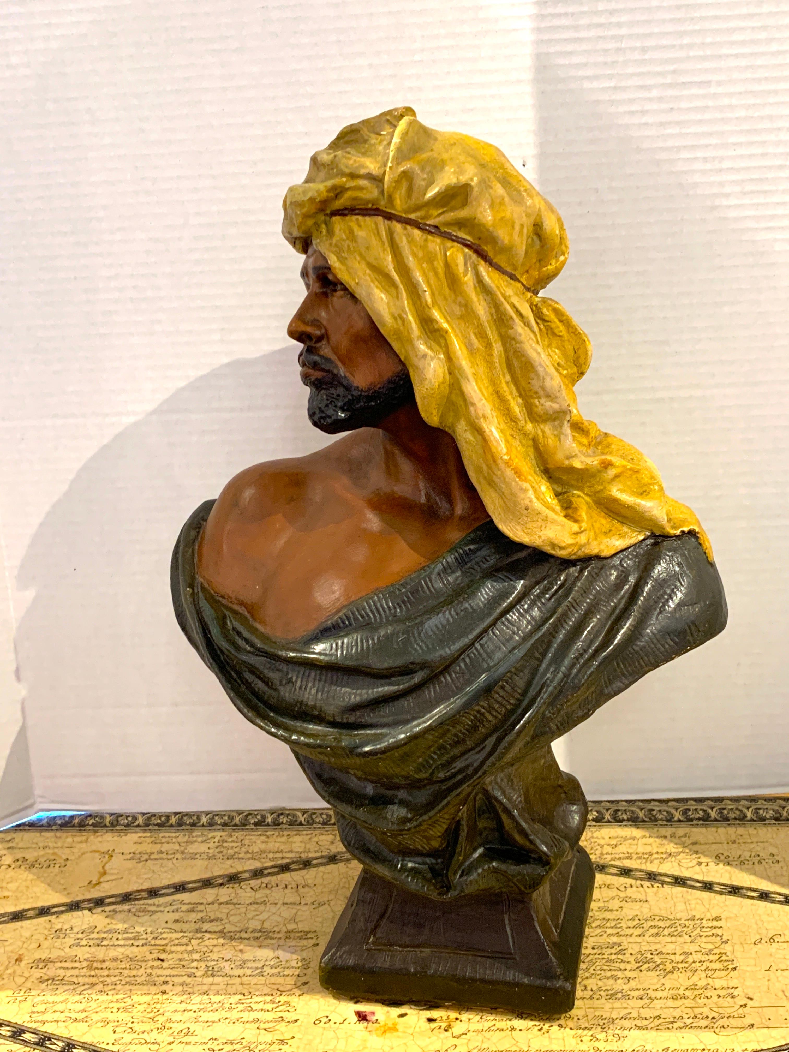 Goldscheider Orientalist bust of an Arab, realistically painted and modeled. Unmarked. Raised on a 5.5