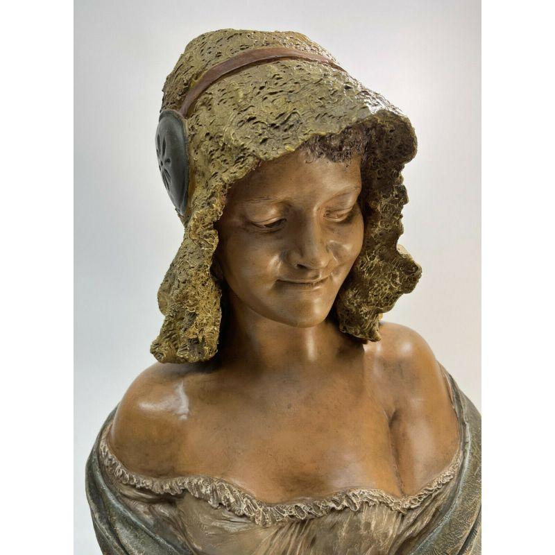 Goldscheider Reproduction Reserve Austrian Terracotta Bust of a Beauty Sculpture

The bust depicts a beauty in an off the shoulder dress and a fabric hat. Goldscheider mark to the back.

Additional information:
Type: Statue        
Material: