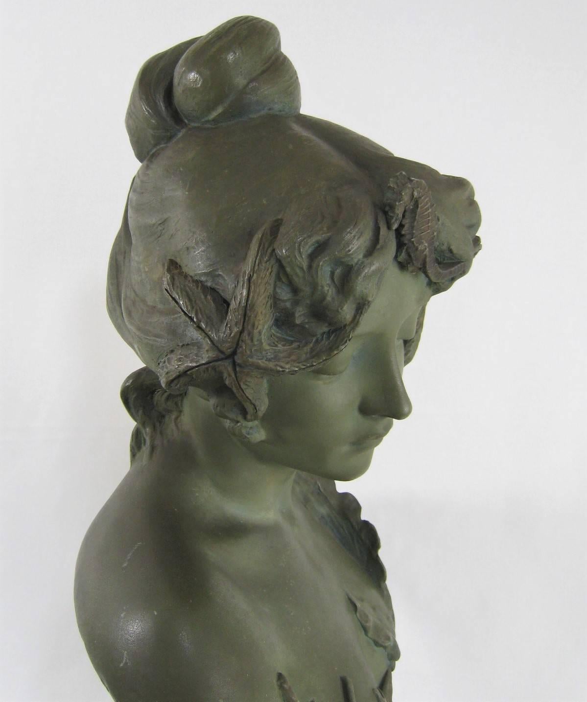 Wonderful terracotta sculpture of a sea goddess or mermaid made by Goldscheider of Vienna. The bust is beautifully sculpted and bears the incised signature of the artist, Gouvay(?). Our maiden's hair is swept up in a bun and decorated with star fish