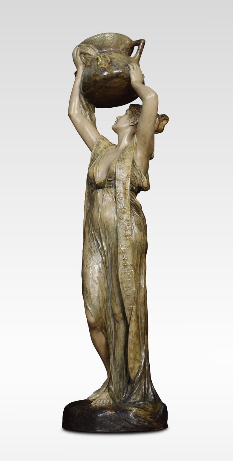 Large Art Nouveau figure of a water carrier modelled as a maiden warring a cascading dress, she carries aloft a large twin-handled Amphora signed ‘F Gross’.
Dimensions:
Height 48 inches
Width 18 inches
Depth 12 inches.