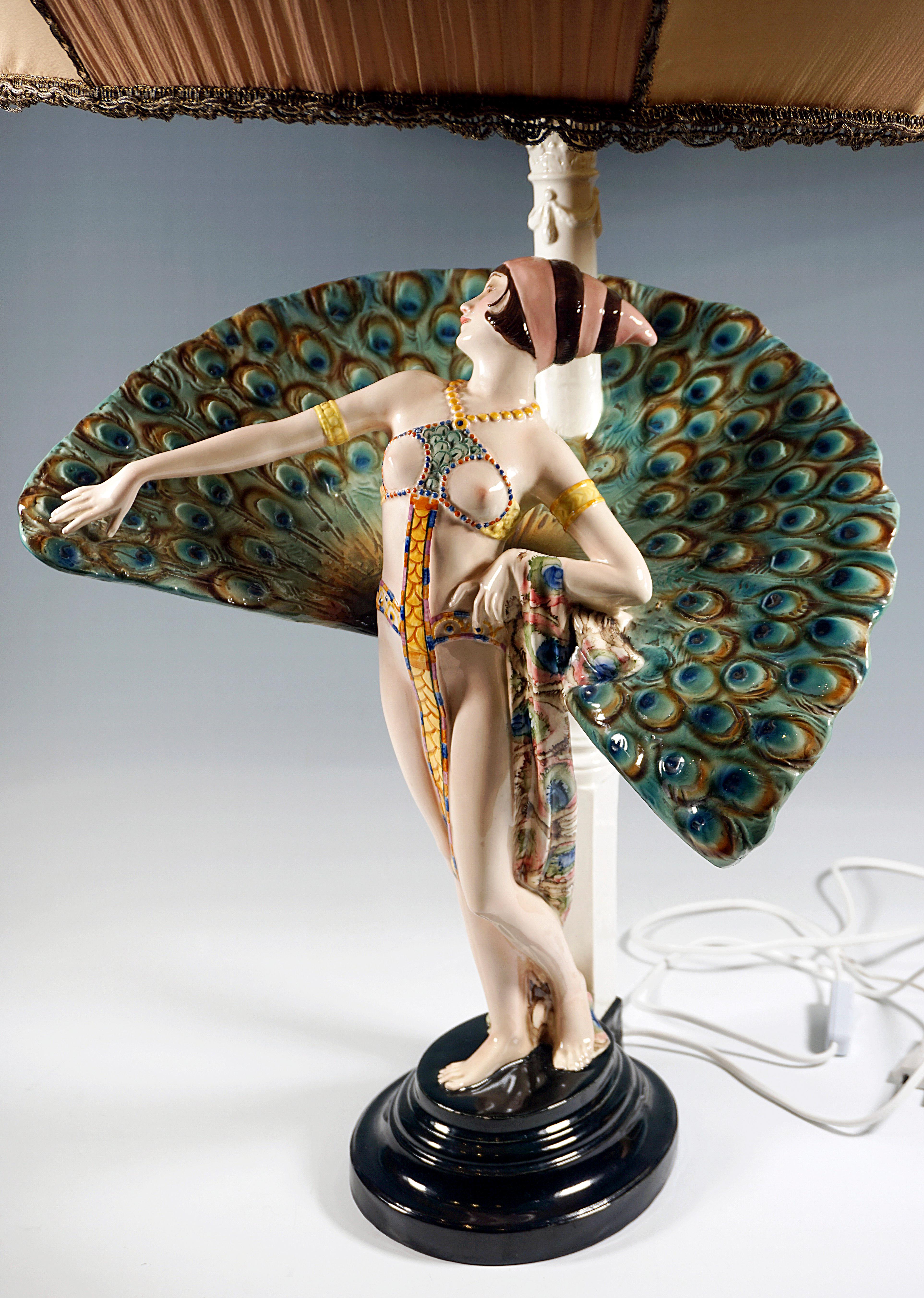 One of the most extraordinary and decorative models that Goldscheider ever has produced:
Upright dancer, leaning slightly backwards and looking to the right exotic dancer with bustier and narrow loincloth, on the short, brown hair a pink-brown
