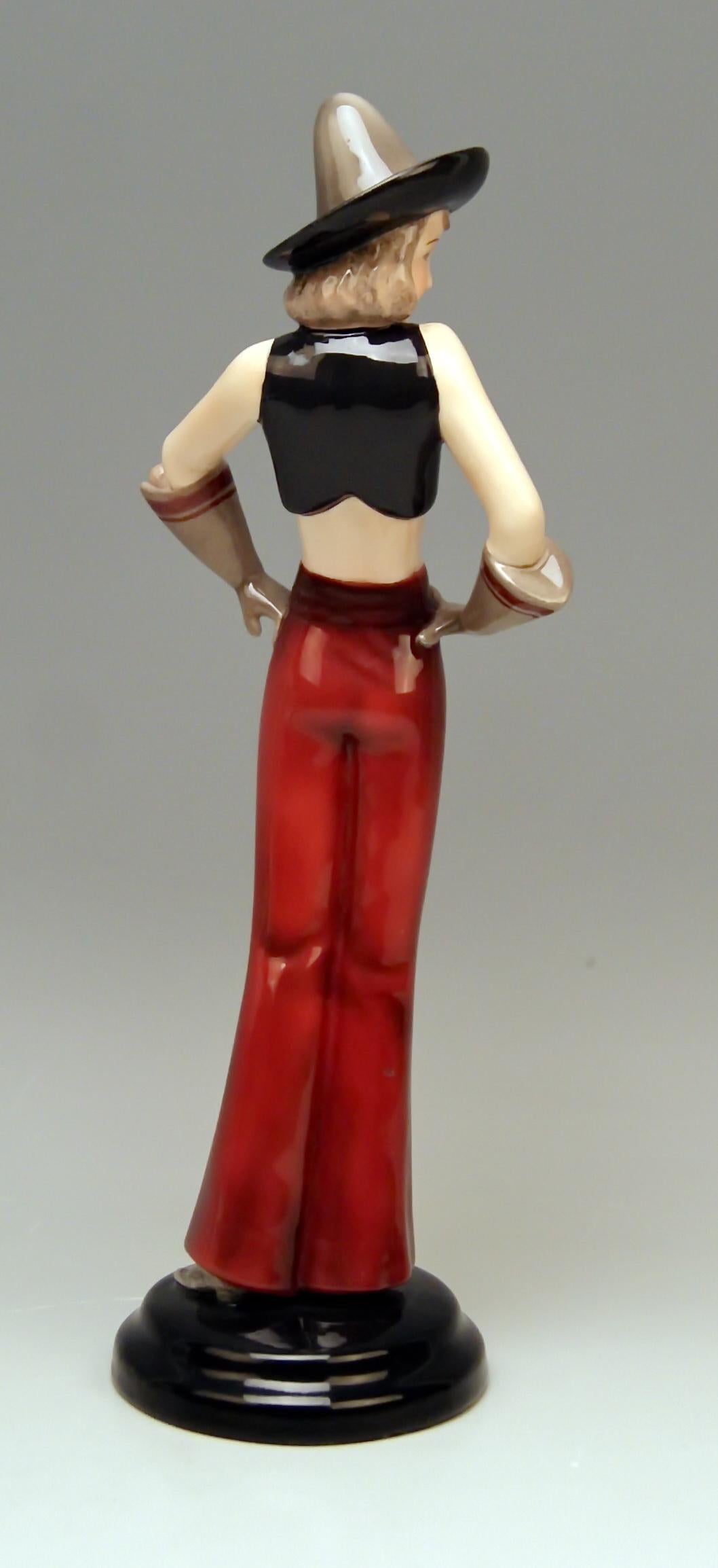 Goldscheider Vienna rare Art Deco figurine:
Girl standing upright / her head is covered with a sombrero hat.

Designed by Stefan (= Stephen) Dakon (1904 - 1992), modelled circa 1934 / made c. 1935-37 /
model number 6912 / 93 /