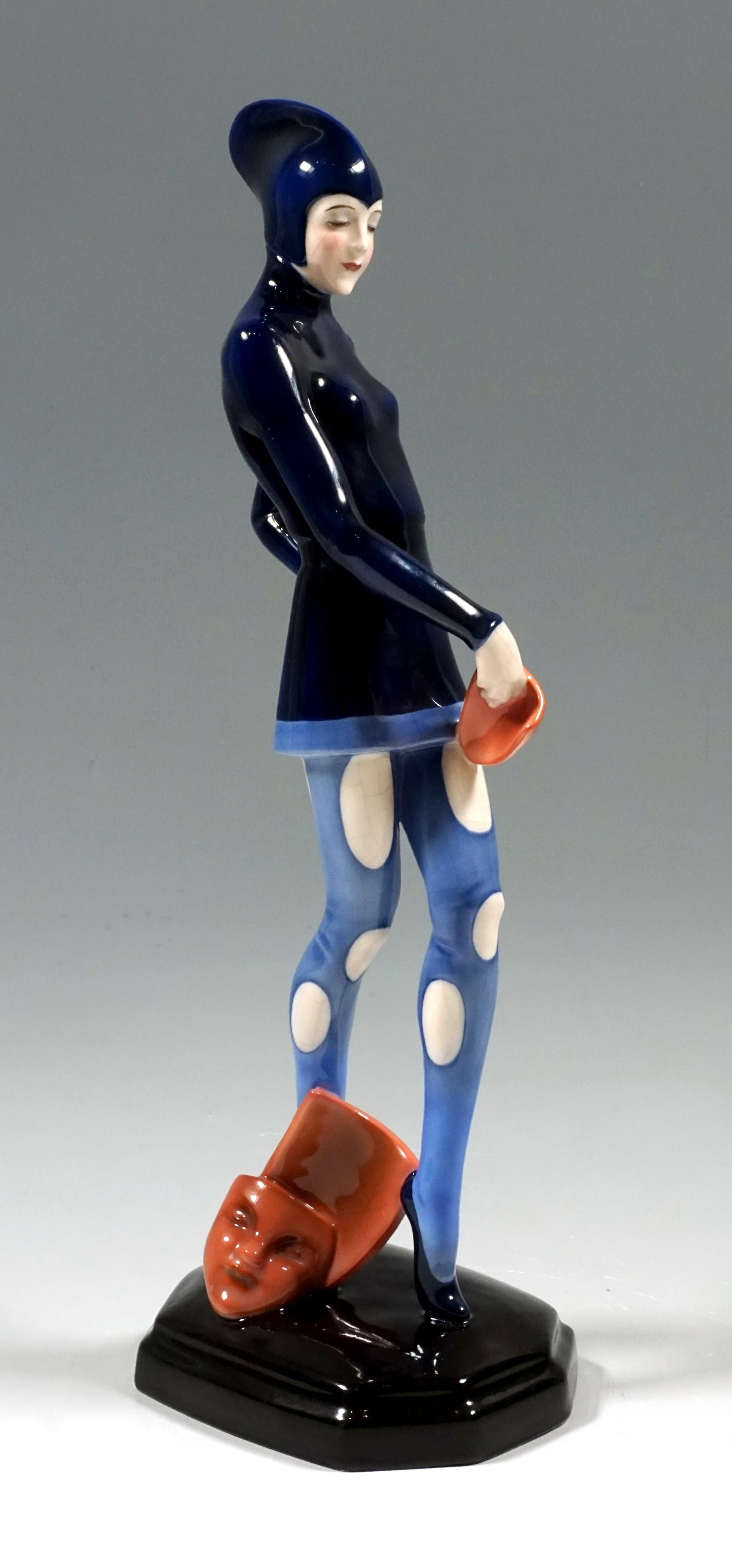 Very rare Art Deco Goldscheider ceramics figurine
The graceful dancer, shown is Rita Zabekow, wears a tight-fitting, long-sleeved, high-necked costume with a matching long hood and tights with large oval cutouts. She holds a mask in her right hand,