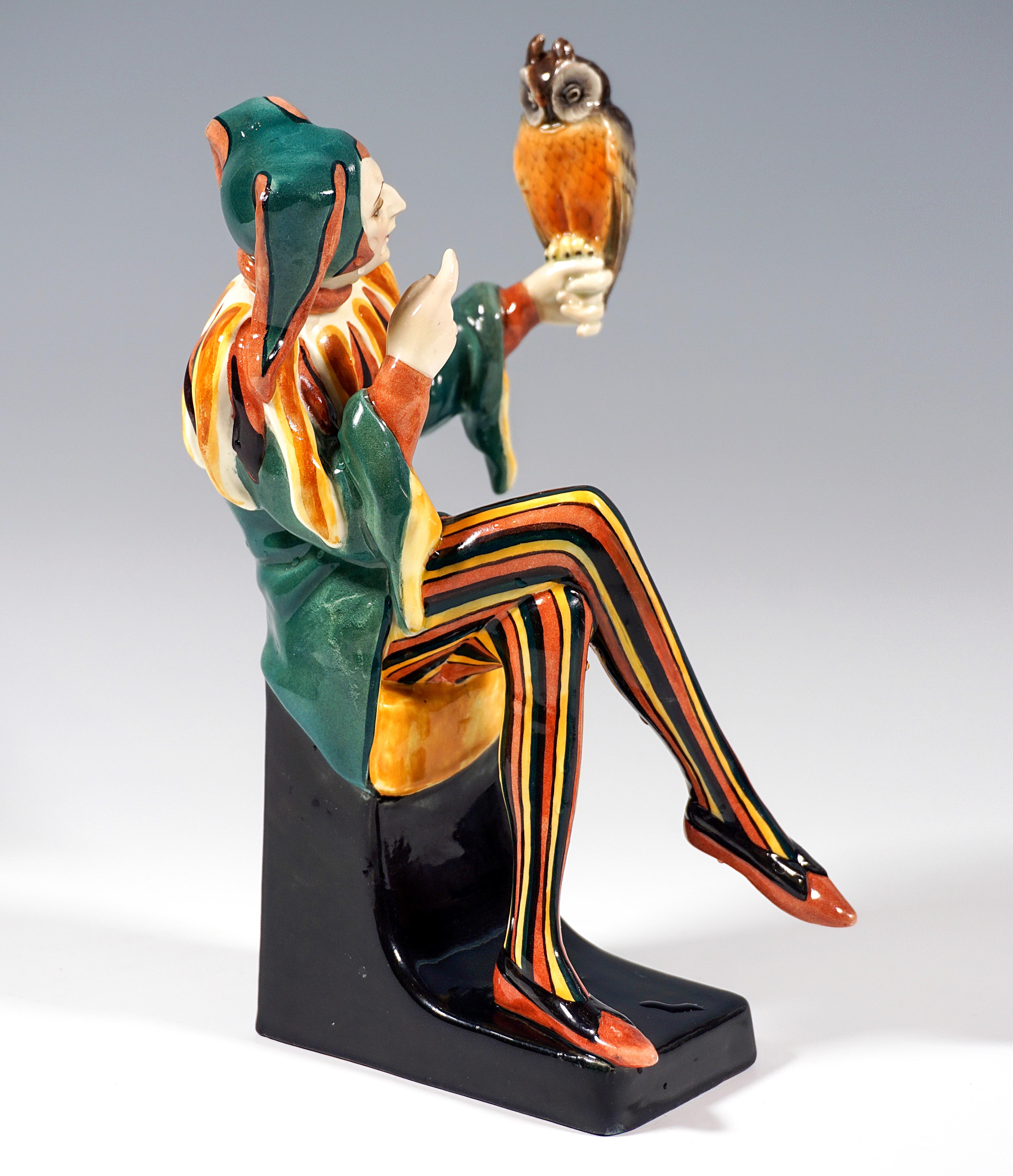 Exceptional Art Déco Goldscheider Figurine by Josef Lorenzl:
Man disguised as a jester with jester's cap, wide shirt and tight trousers seated on a black pedestal, on his left outstretched hand an owl, symbol of prudence and wisdom, reprimanding it