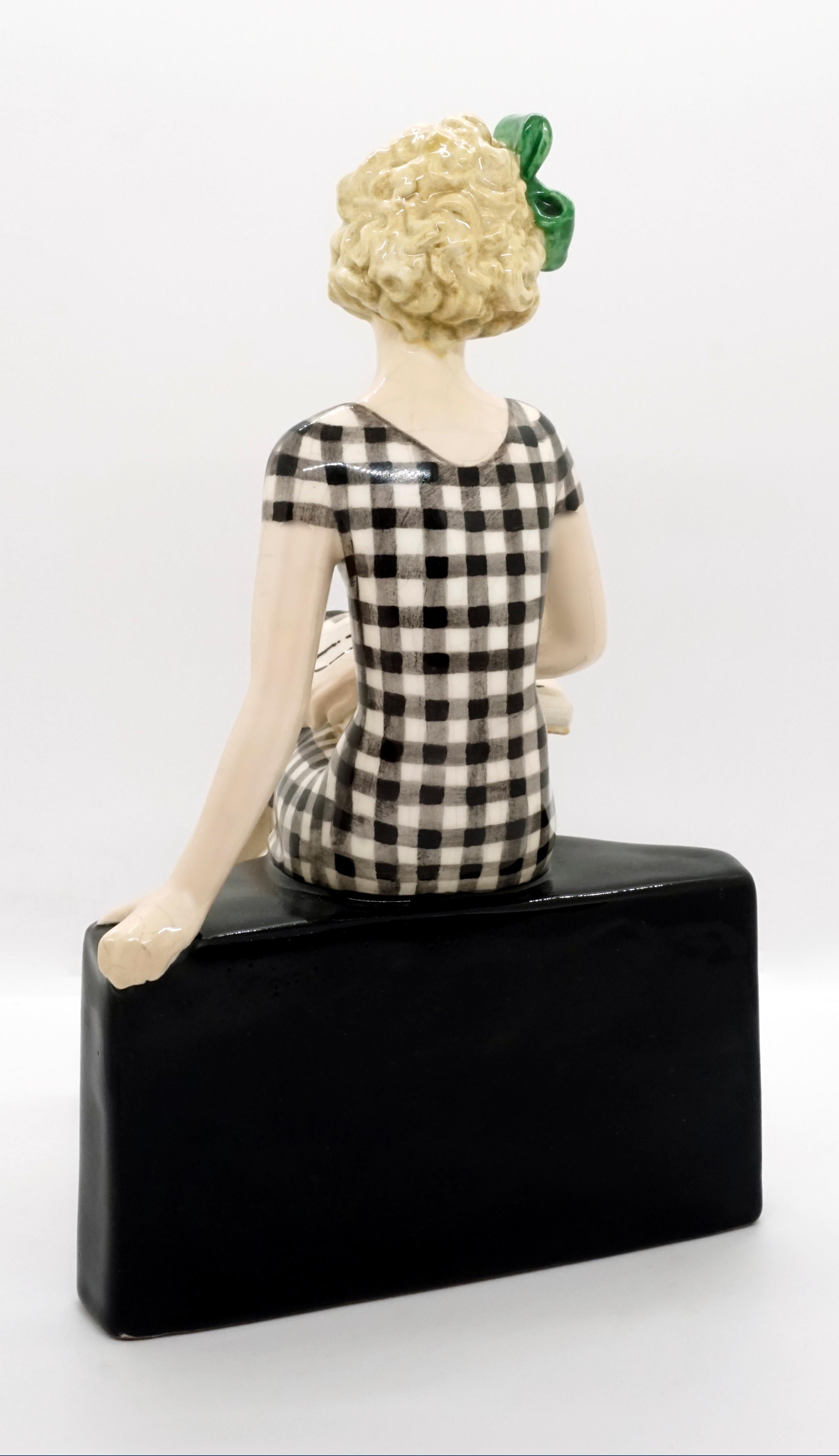 Austrian Goldscheider Vienna Girl with Book Sitting on a Bookshelf by Dakon, circa 1935