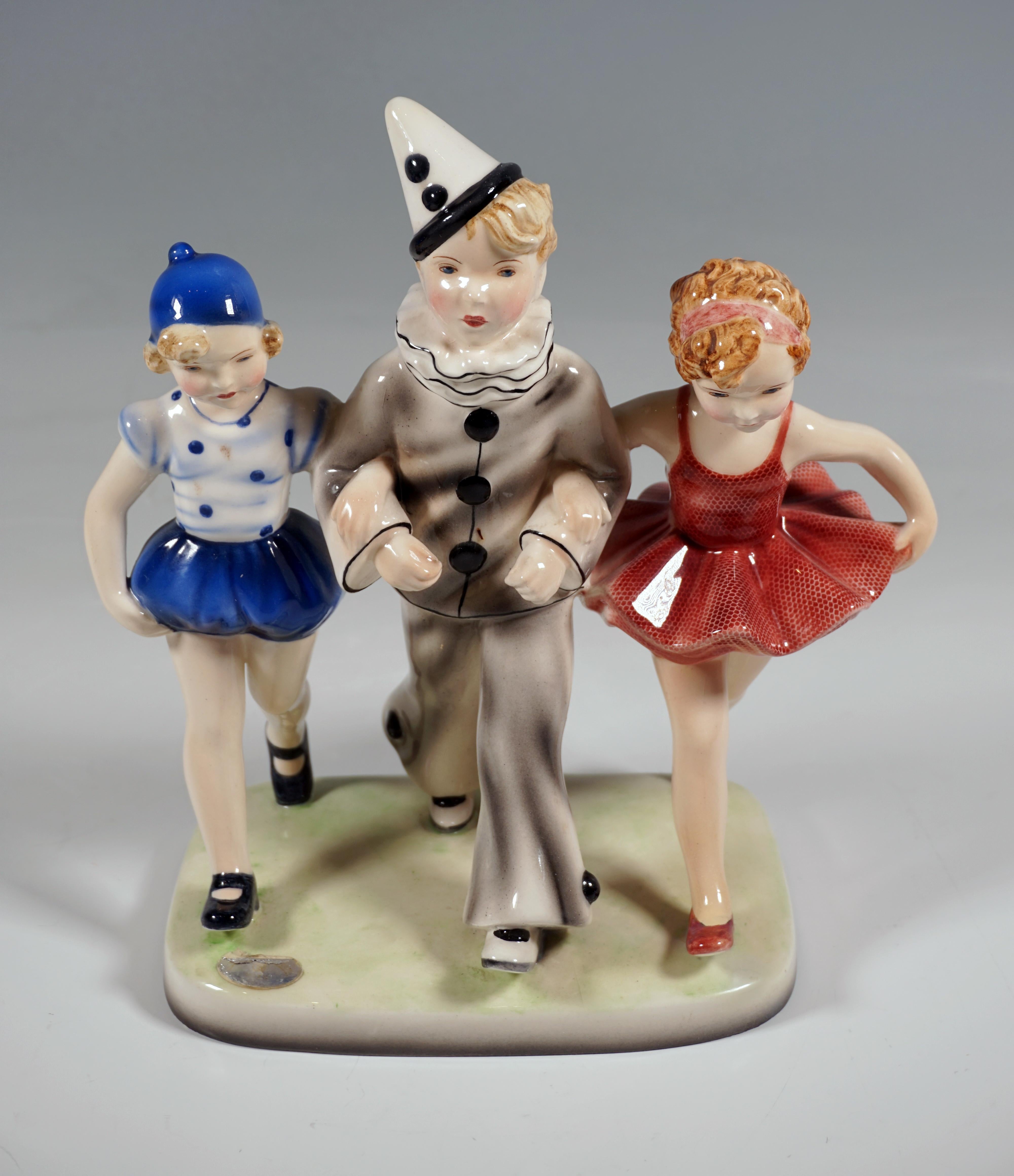 Hand-Crafted  Goldscheider Vienna Group, 'Pierrots' Three Children Walking, by Dakon, ca 1938 For Sale