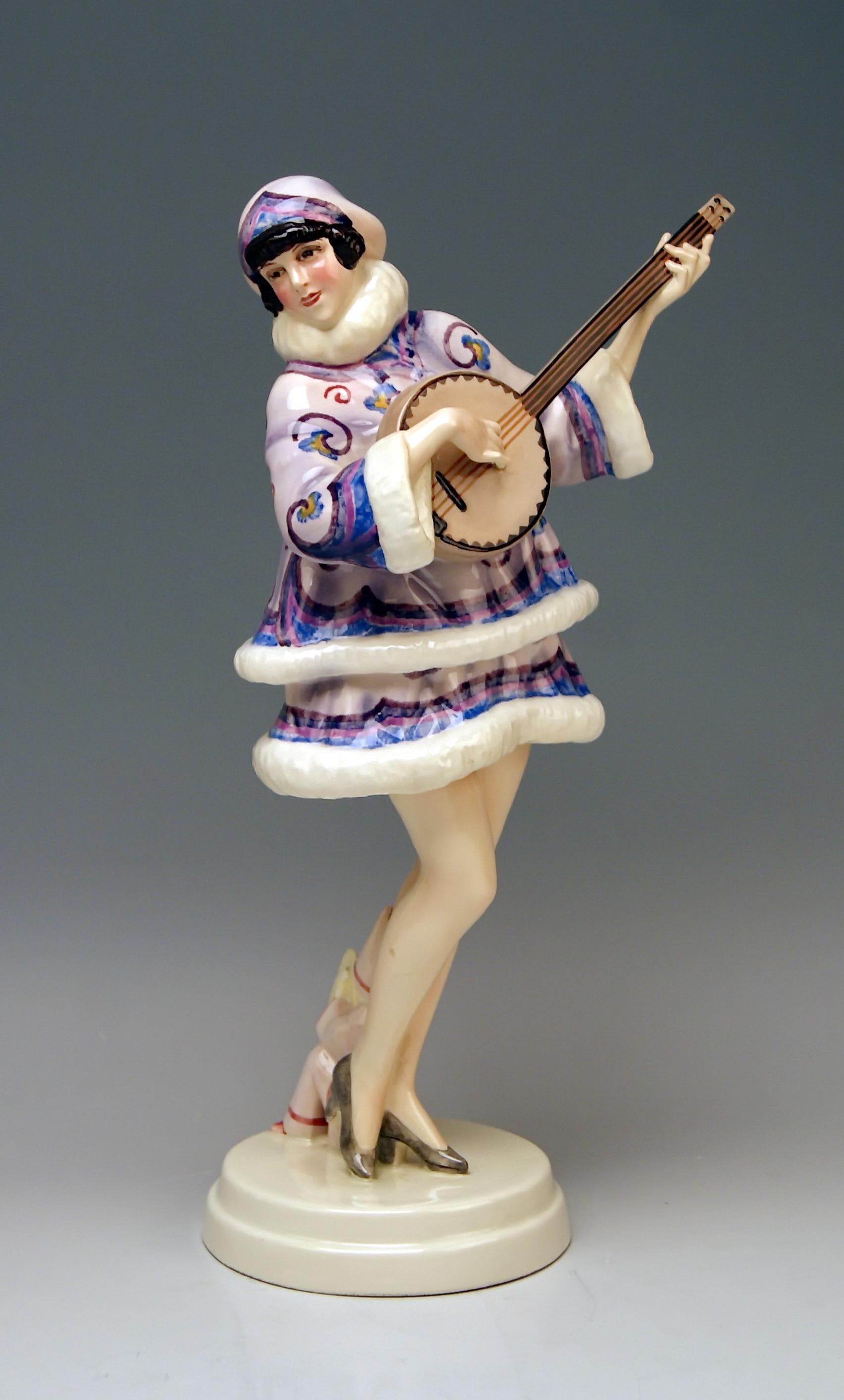 Goldscheider Vienna stunning lady figurine: The Banjo Player.

Designed by Stefan (= Stephen) Dakon (1904-1997).
Stefan Dakon was a well-known Austrian sculptor and ceramics artist. He worked in close association with Josef LORENZL: Both artists