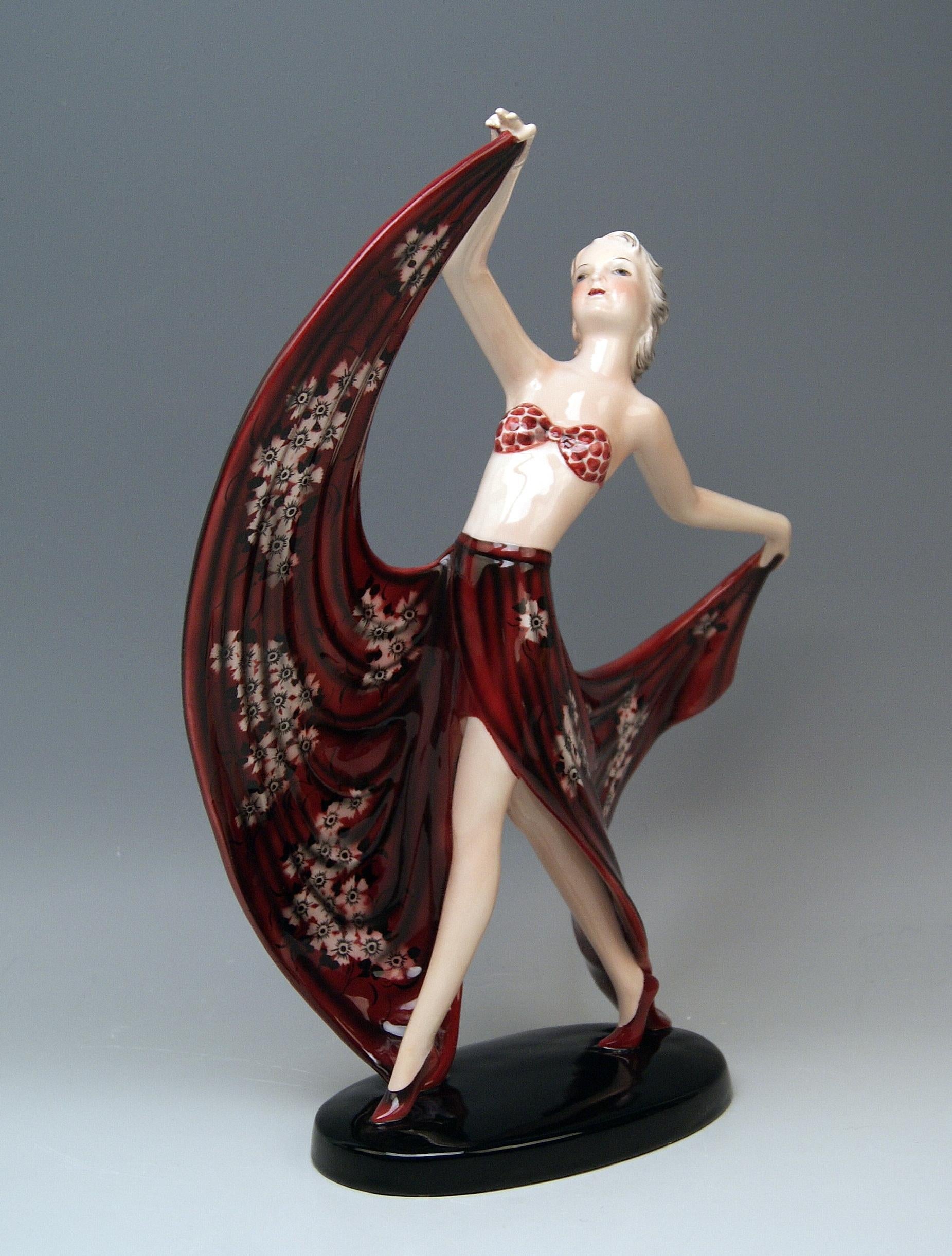 Goldscheider Vienna lady dancer called champagner.

Designed circa 1937 by Stephan Dakon (1904-1997).
made circa 1938. 
model number 7857 / 167 / 2
painter's sign & signature 'Dakon' at reverse side of base existing / additionally, the
