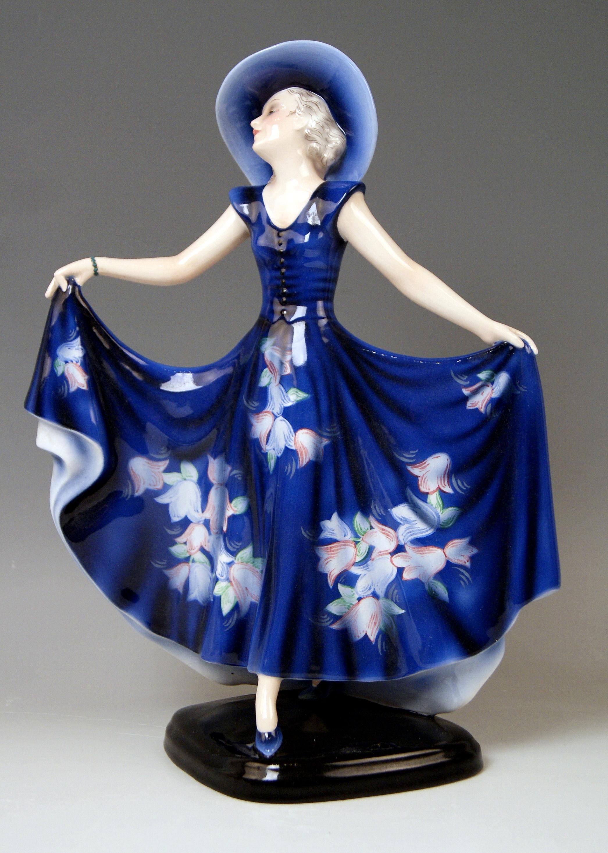 Goldscheider Vienna lady dancer liane wide-brimmed hat clad in blue dress.

Designed by Josef Lorenzl (1892-1950) / one of most important designers having been active for Goldscheider manufactory in period of 1920-1940 / designed, circa