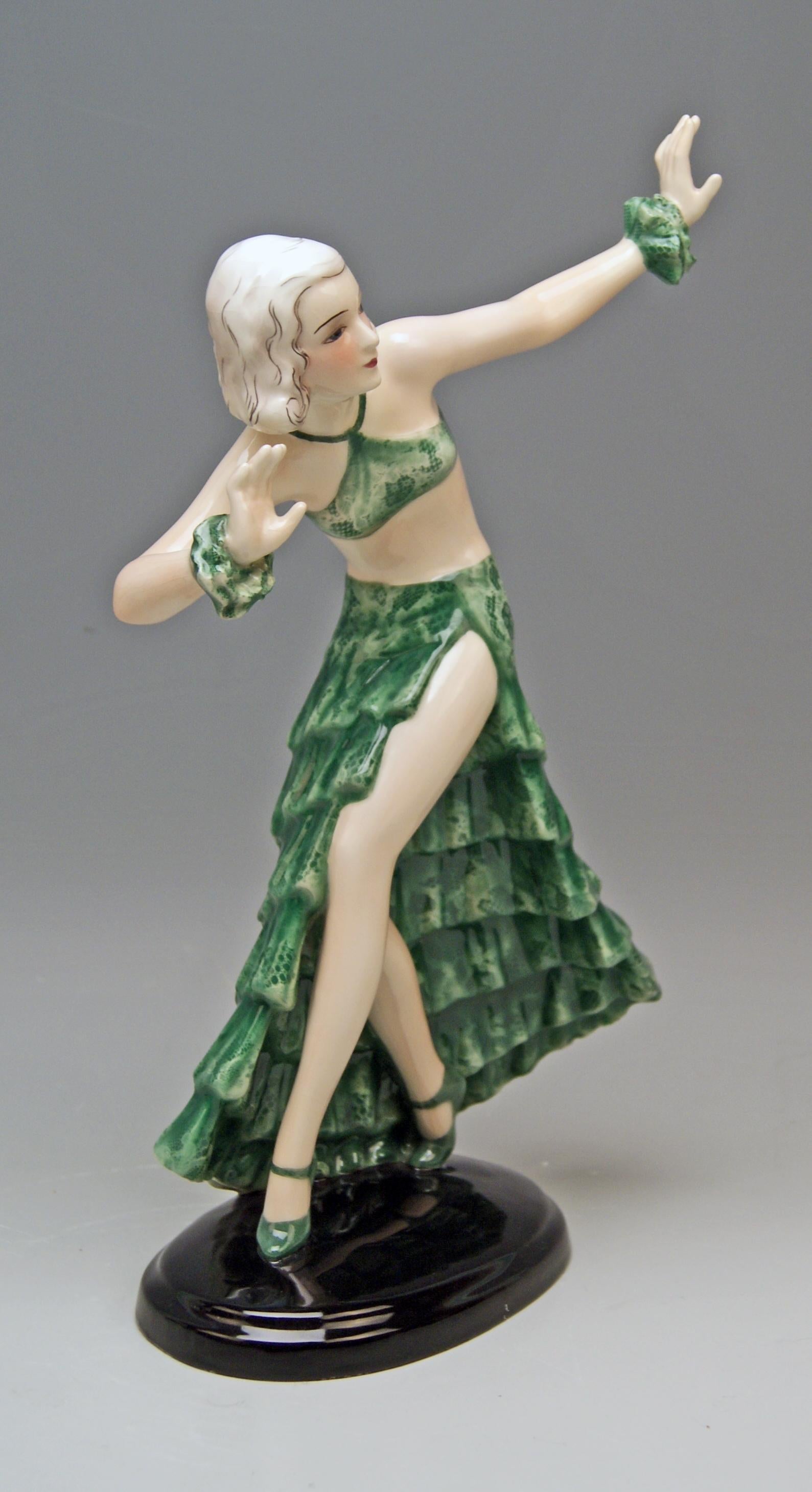 Goldscheider Vienna dancing lady clad in green long skirt and top

Designed by Josef Lorenzl (1892-1950), circa 1934-1935
made 1936 
model number 7058 / 90 / 19

Hallmarked:
Goldscheider Wien ( = VIENNA) stamp mark
Made in Austria /