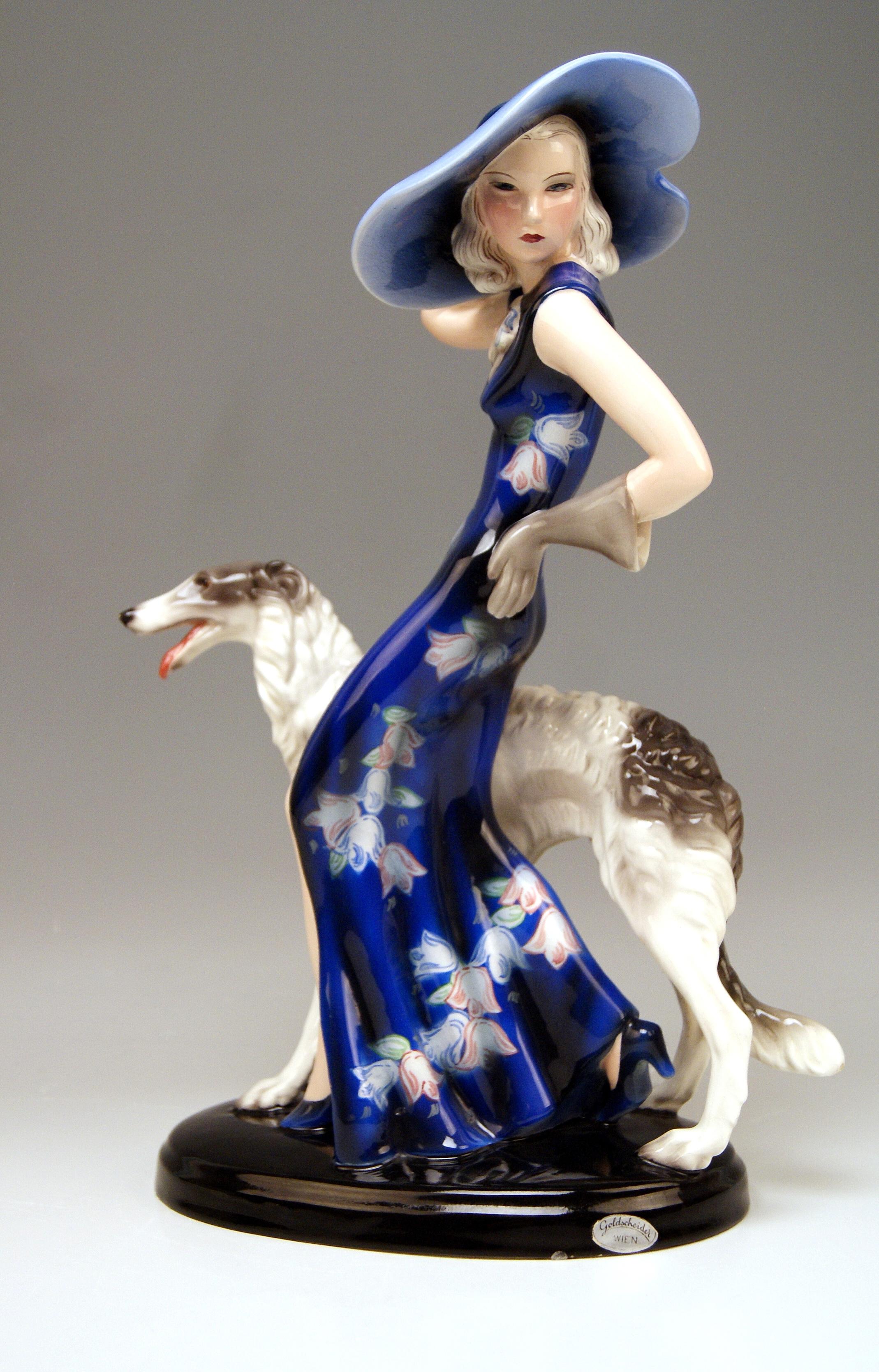Elegant Lady Wearing A Hat with Broad Brim, Accompanied by A Borzoi Dog

Design:
Klàra (Claire) Herczeg / Weiss (1906-1997). Model 7367 was created 1935 / 36. 
Made circa 1936.

Hallmarked:
Model Number 7367 / 41 / 19
The following mark is