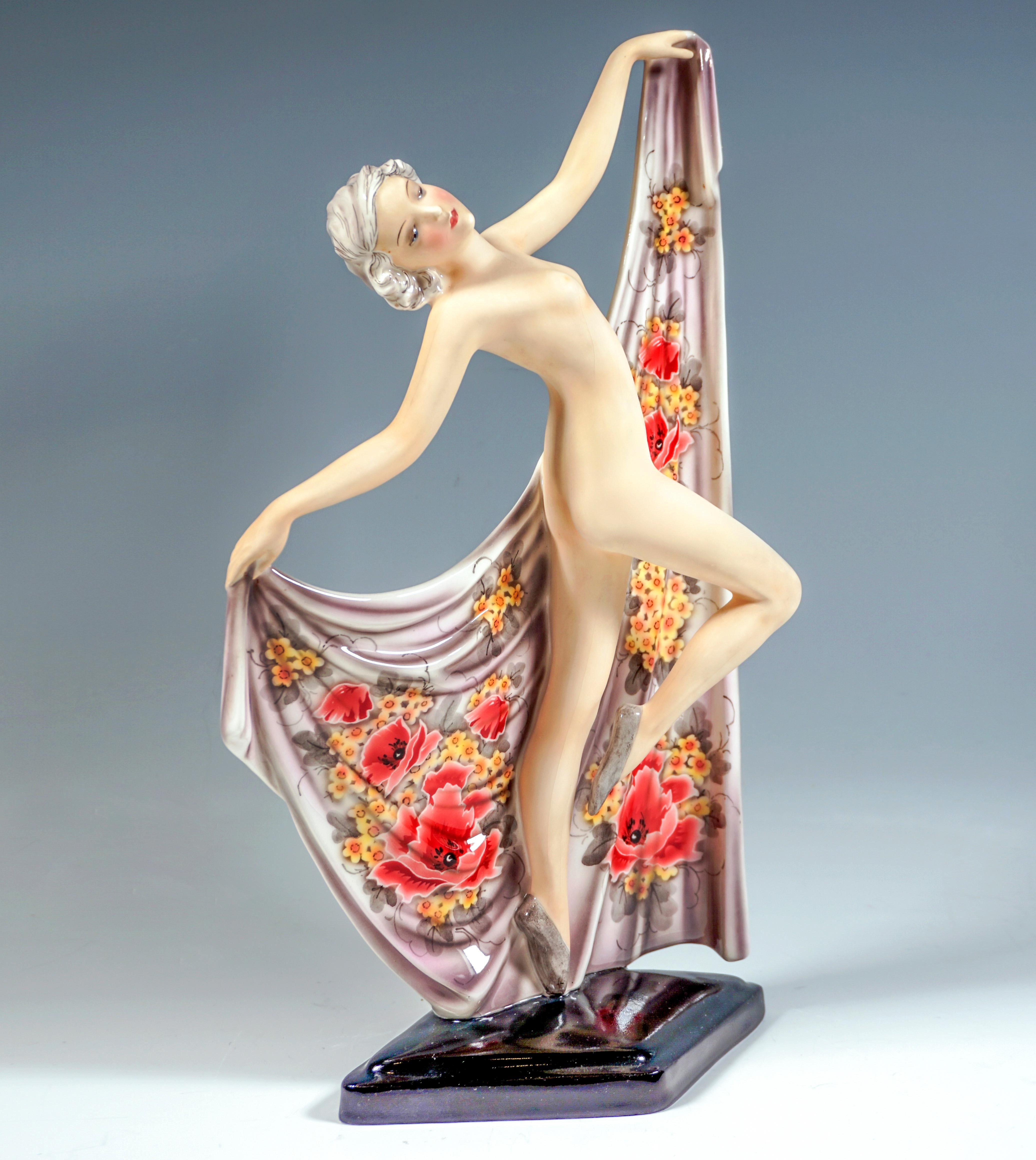 Rare Goldscheider ceramic figurine of the late 1930s:
Only with ballet shoes dressed young pretty lady with curly hair, with turned to the side and tilted backwards upper body balancing on the left tiptoes, pulling up the right leg, and holding up a