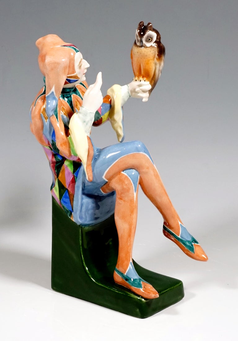 Exceptional Art Déco Goldscheider Figurine by Josef Lorenzl
The young man dressed as a jester with a fool's cap sits on a green base. An owl sits on his left outstretched hand. With the right index finger raised, the fool seems to regulate the