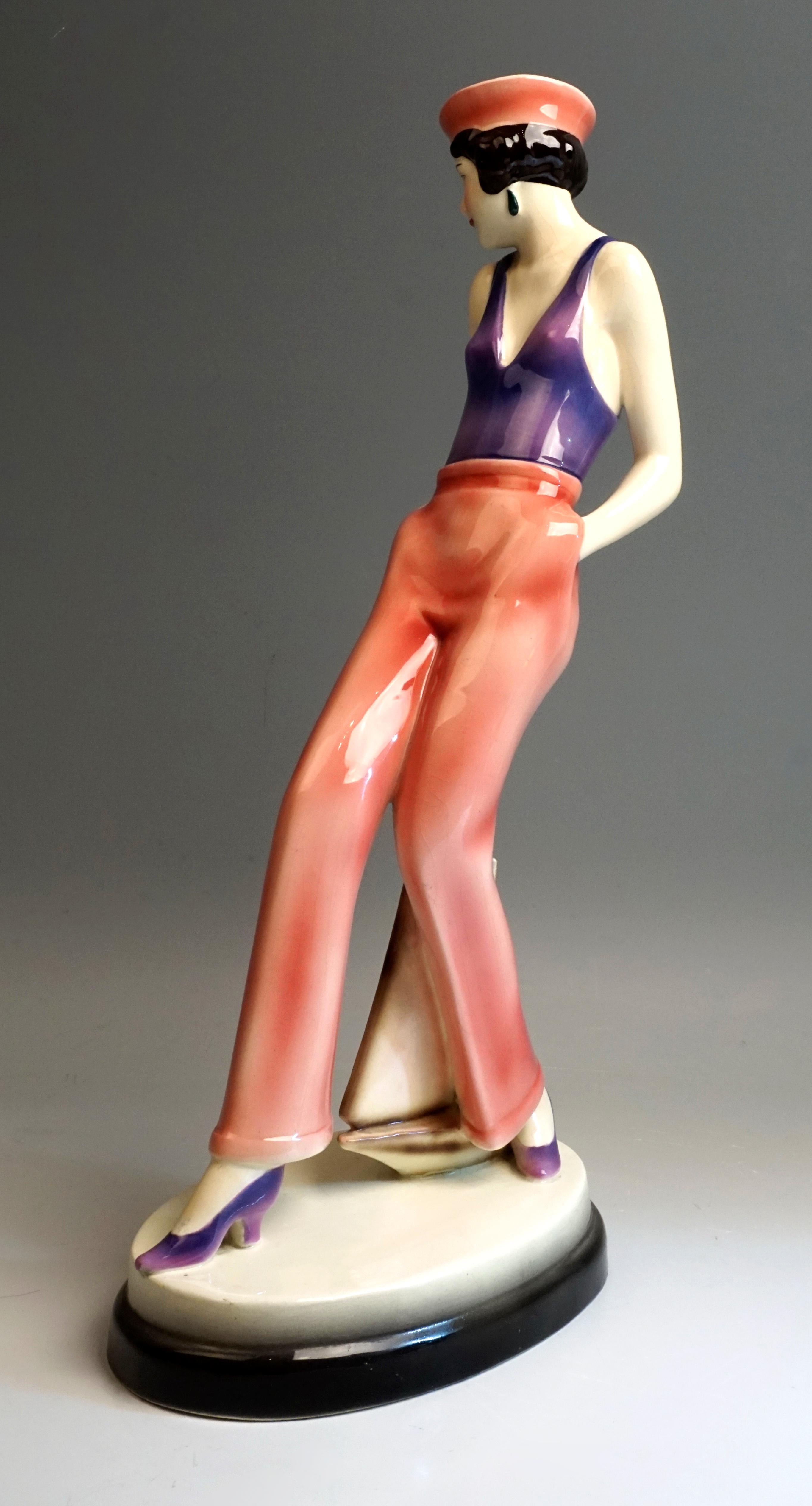 Very rare Art Deco Goldscheider ceramics figurine, circa 1930

The young dancer wears a sleeveless top that is reminiscent of a bathing suit and wide trousers, a sailor hat sits on her short black curly hair. Looking to the right, she takes a step