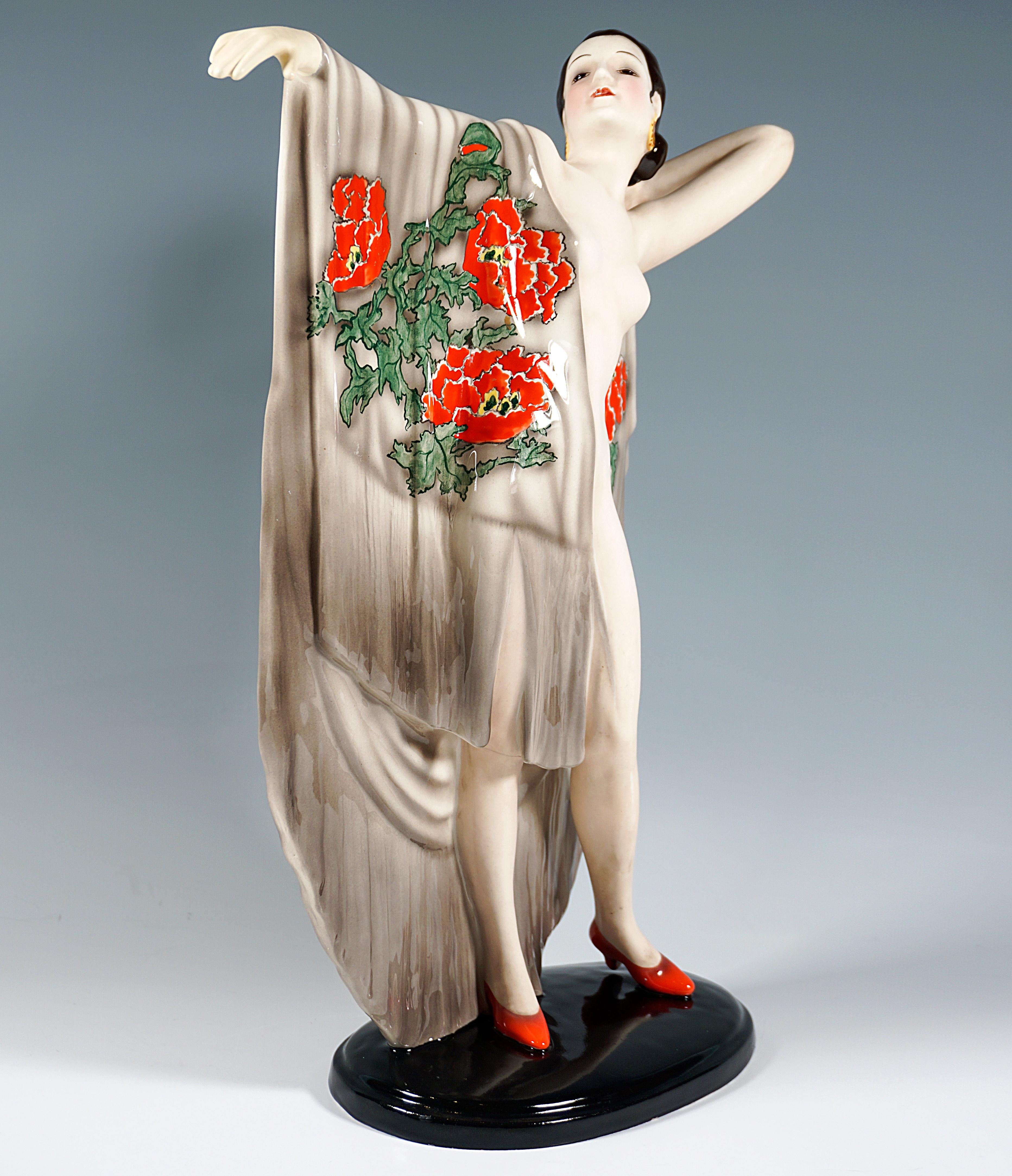 Rare Goldscheider Ceramic Figurine of the 1940s:
Standing young pretty lady with dark hair tied at the nape of her neck and ear jewelry in the style of a Spanish woman, presenting a large beige cloth with large-scale red poppy decoration on her