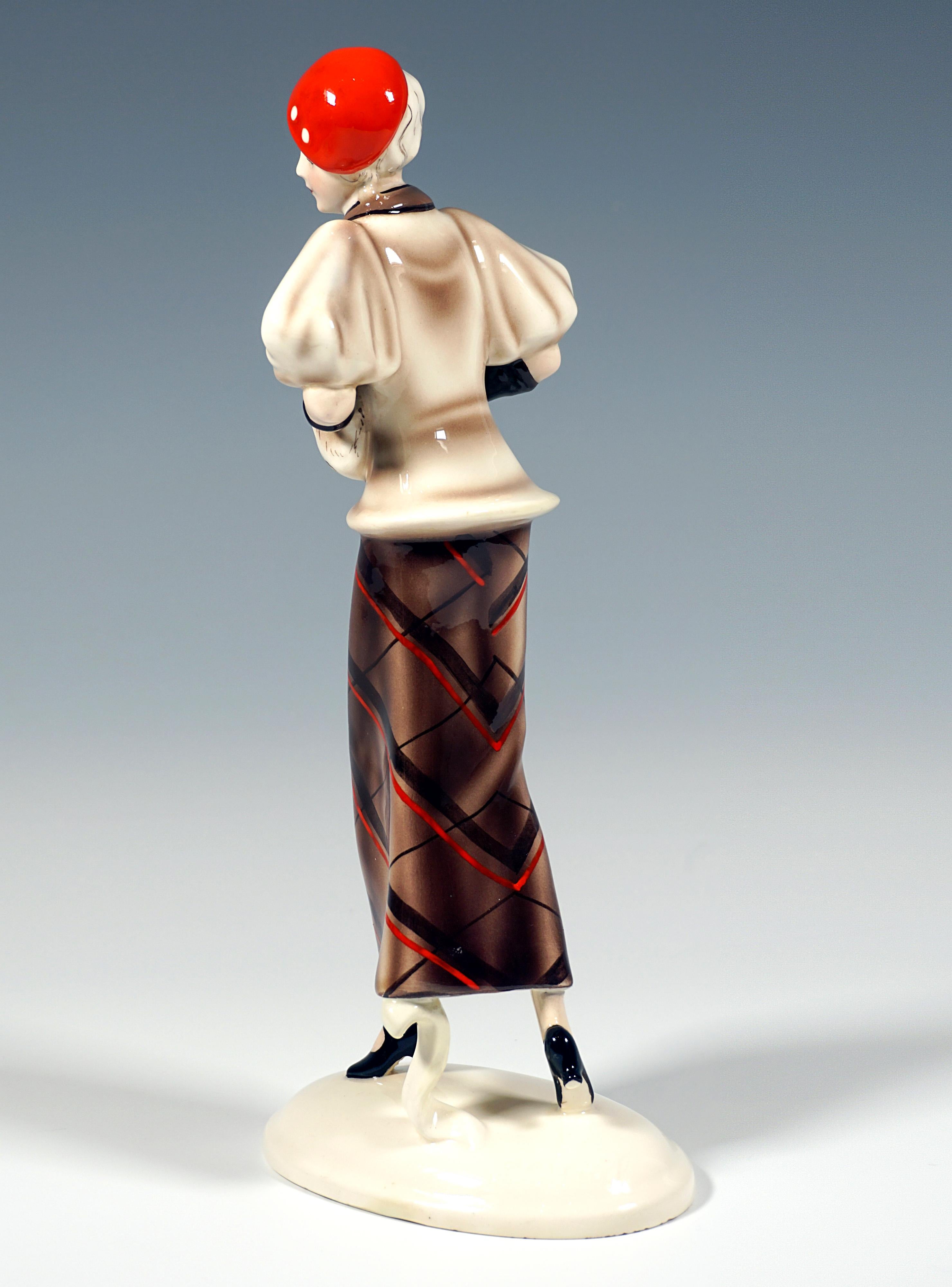 Austrian Goldscheider Vienna Striding Lady With Cape And Muff, by Josef Lorenzl, ca 1934 For Sale