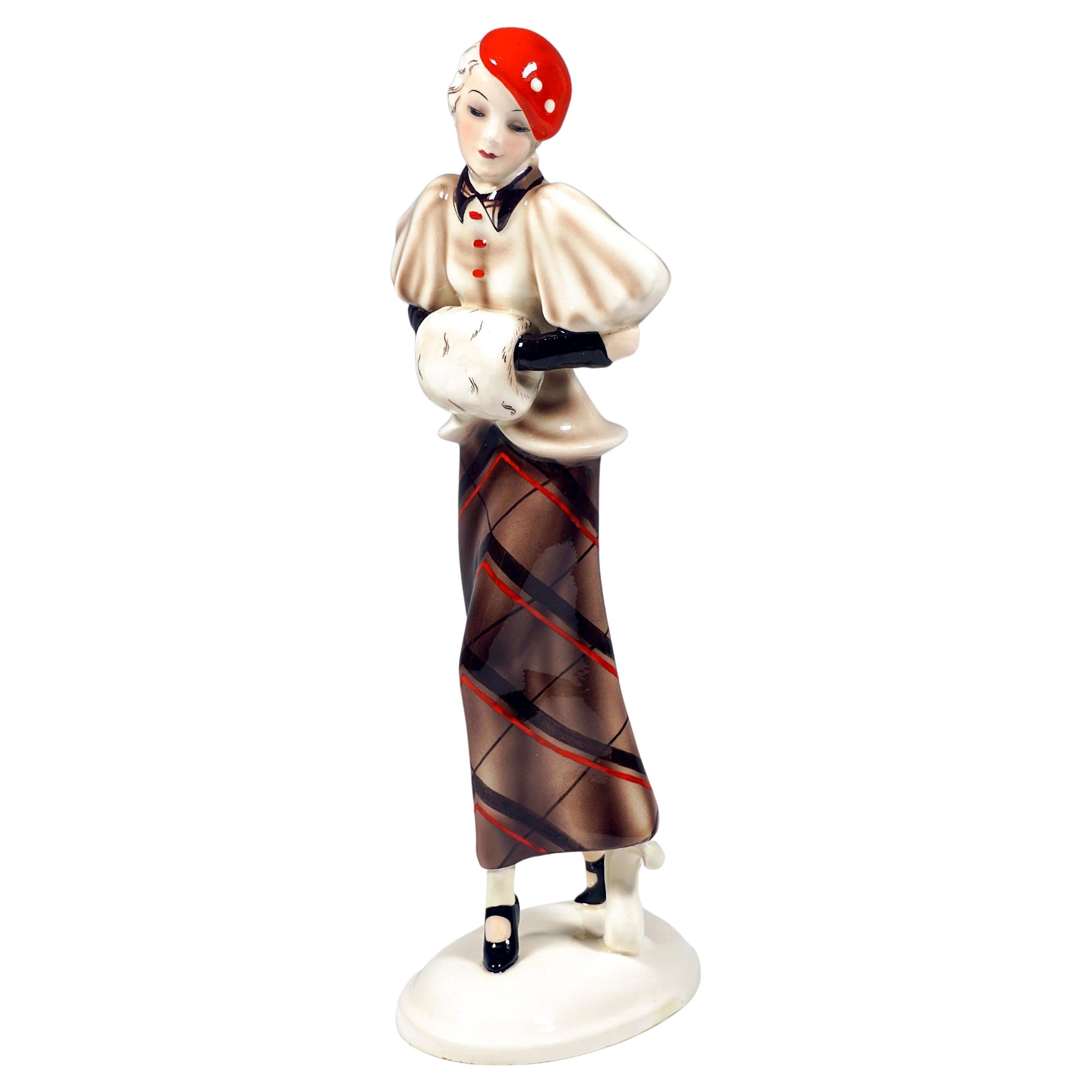 Goldscheider Vienna Striding Lady With Cape And Muff, by Josef Lorenzl, ca 1934 For Sale