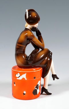 Goldscheider Vienna Young Lady Sitting on a Red Round Box by Dakon, Ca. 1936