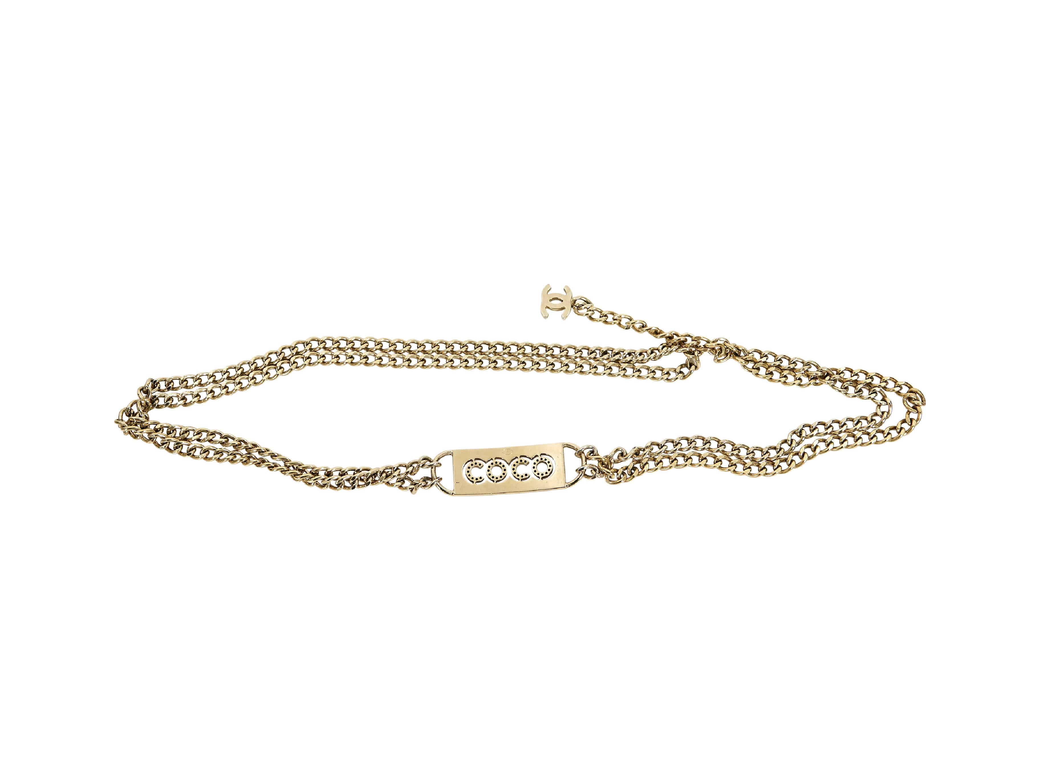Product details:  Vintage goldtone Coco chain belt by Chanel.  'Coco' plaque accent.  Clasp closure.  28