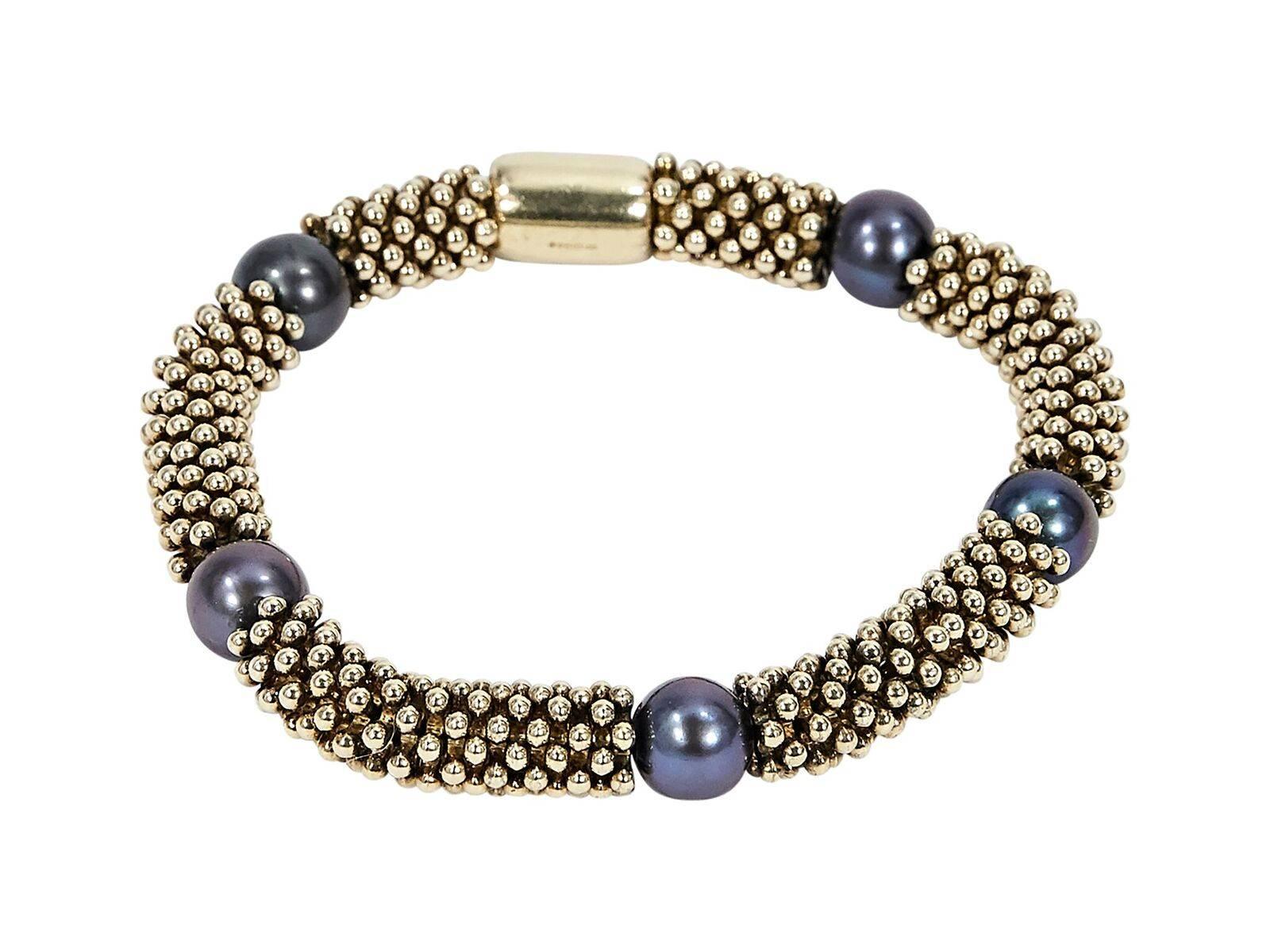Product details:  Goldtone Effervescence bracelet by Links of London.  Accented with black pearls.  Stretch fit. 
Condition: Pre-owned. Very good.
Est. Retail $325