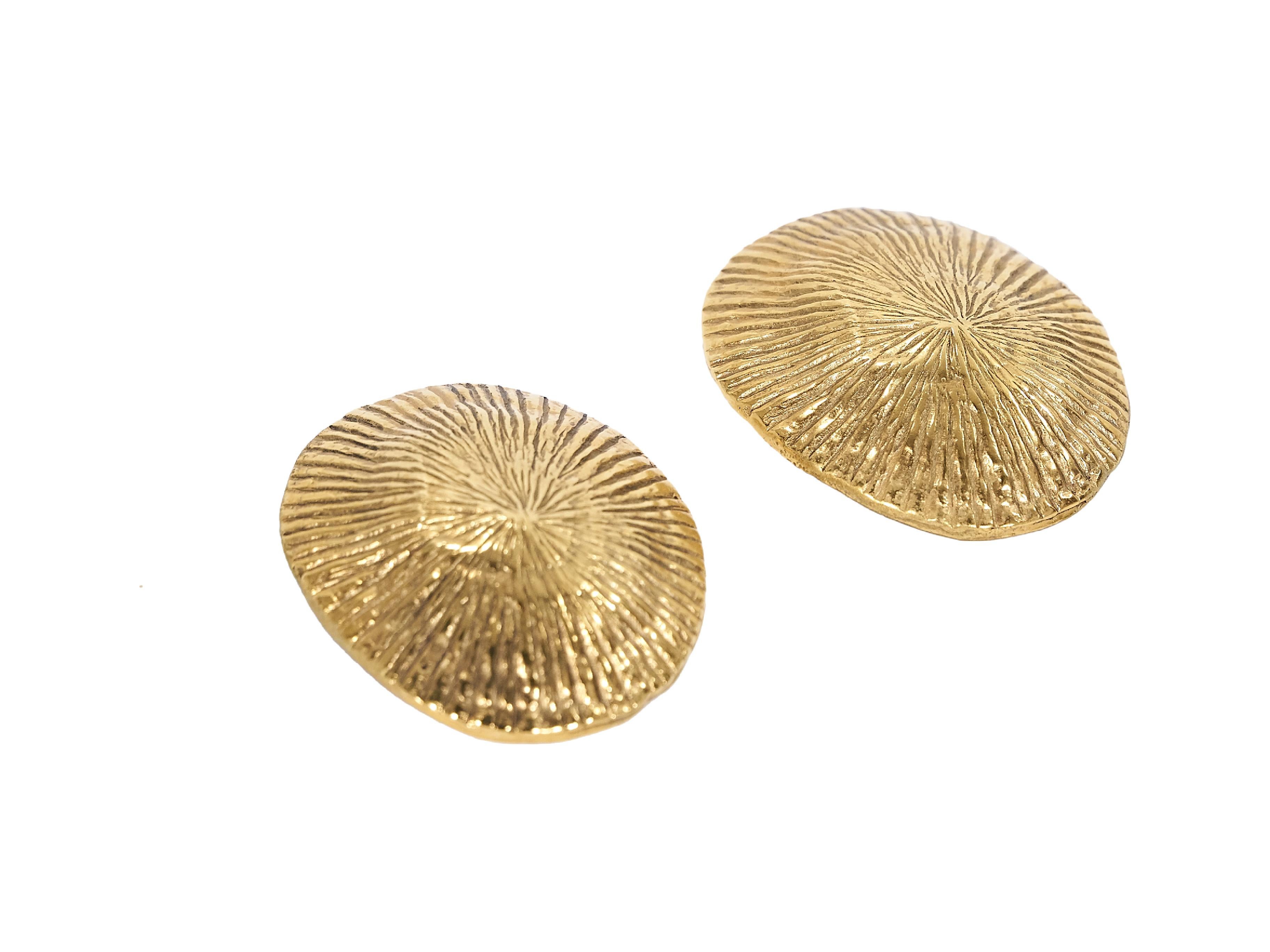 Product details:  Vintage goldtone seashell earrings by Yves Saint Laurent.  Clip-on backing.  2