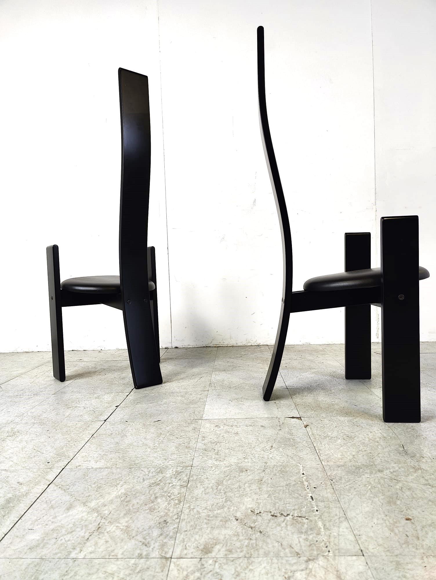 Set of 6 dining chairs model 'Golem' designed by Vico Magistretti voor Poggi.

The chairs are made of black lacquered wood and upholstered with black skai.

Beautiful slim and modern design.

Good condition, normal age related wear

The chair with