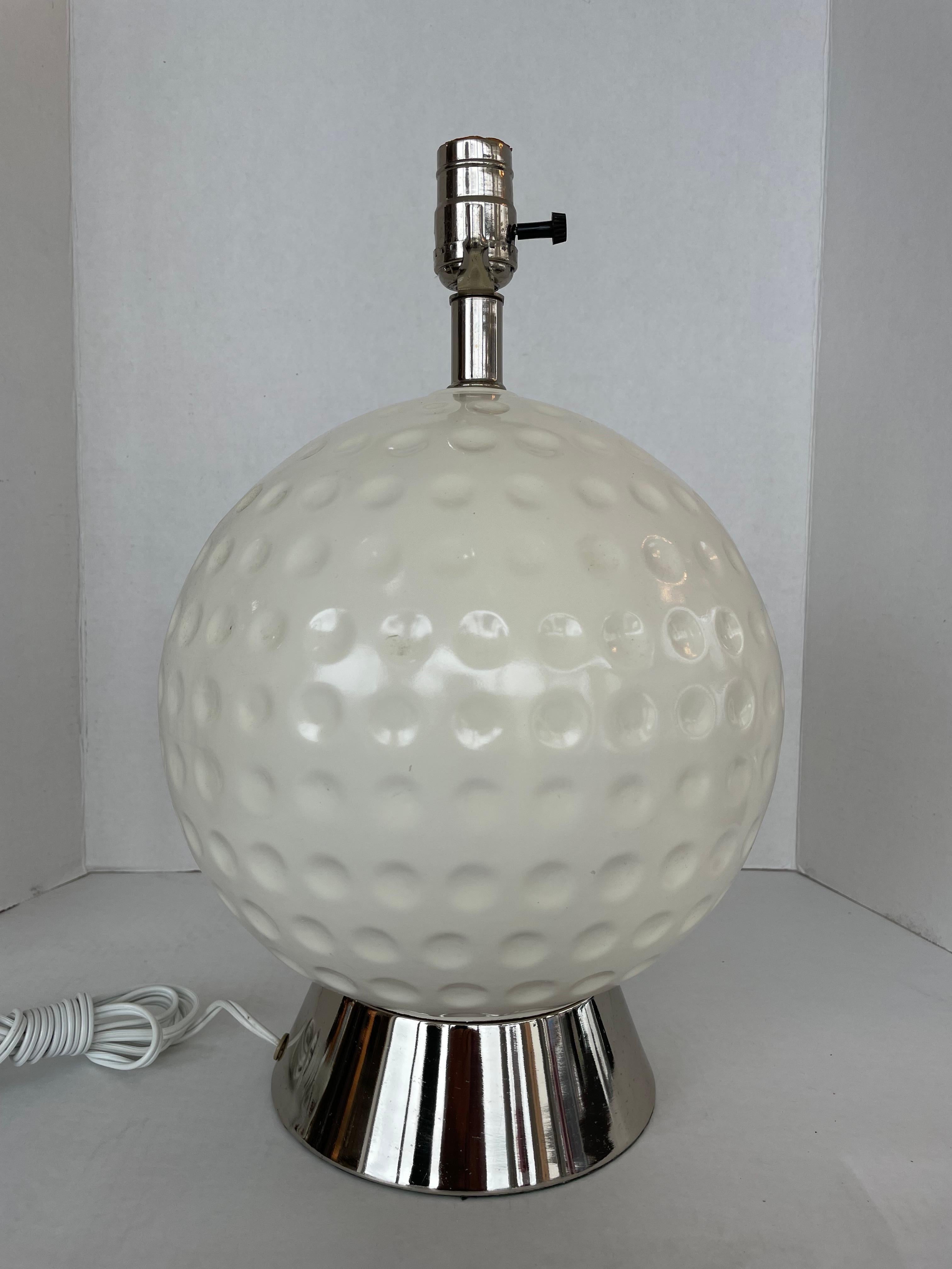 This stylish and chic table lamp dates to the 1970s and is very much in the mod feel of that time period.

The piece is fabricated in a glazed ceramic with a polished chrome base and hardware.

Note: Requires one Edison based light bulb.

Note: