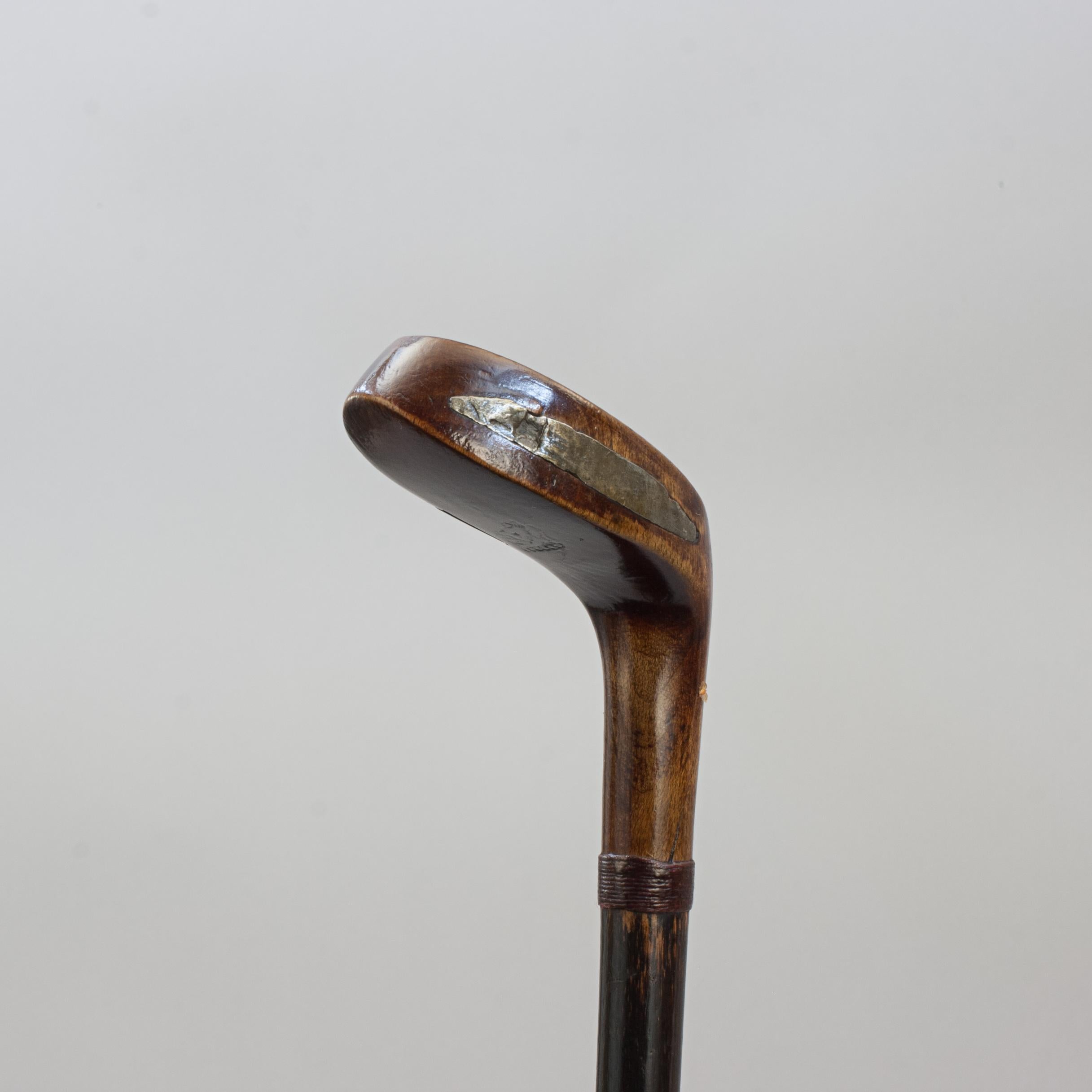 Antique Sunday Club, Golf Club Walking Stick.
A desirable walking cane with the handle in the shape of a golf club head. The gentleman's walking stick has a beechwood socket head handle with a pegged face insert and a lead weight to the rear. It is